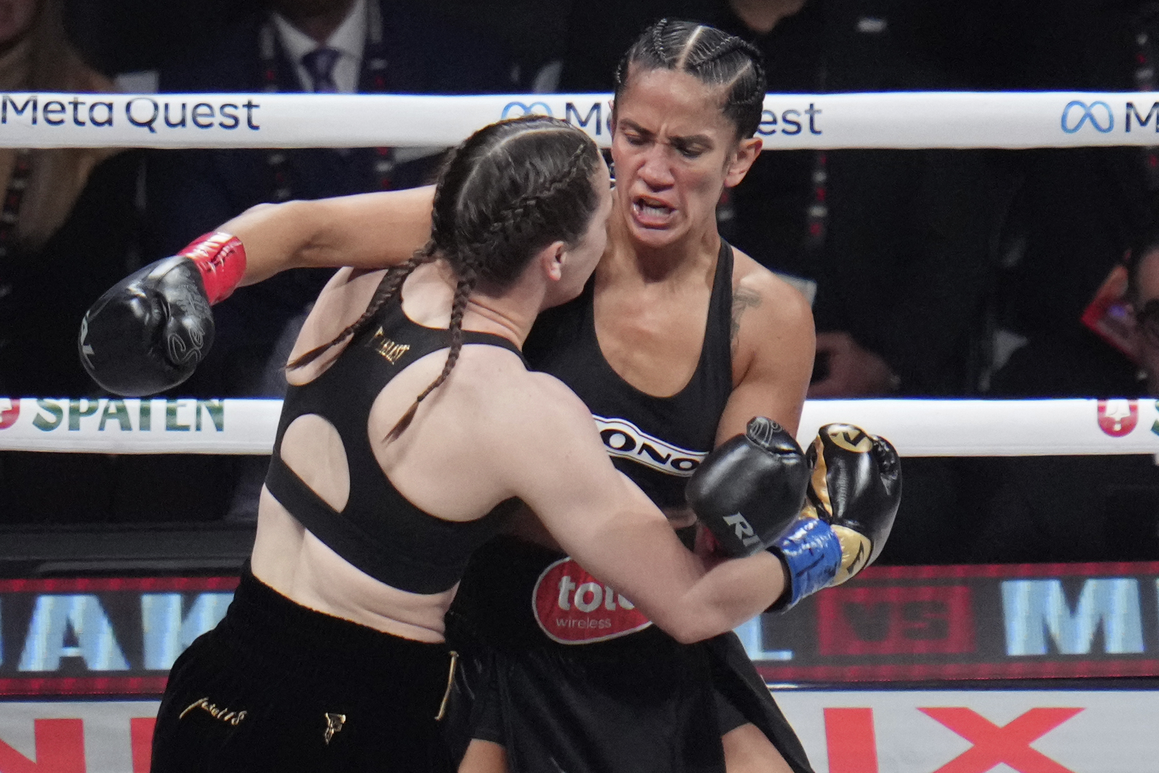 FILE - Amanda Serrano, right, and Katie Taylor fight during their undisputed super lightweight title bout, Friday, Nov. 15, 2024, in Arlington, Texas.