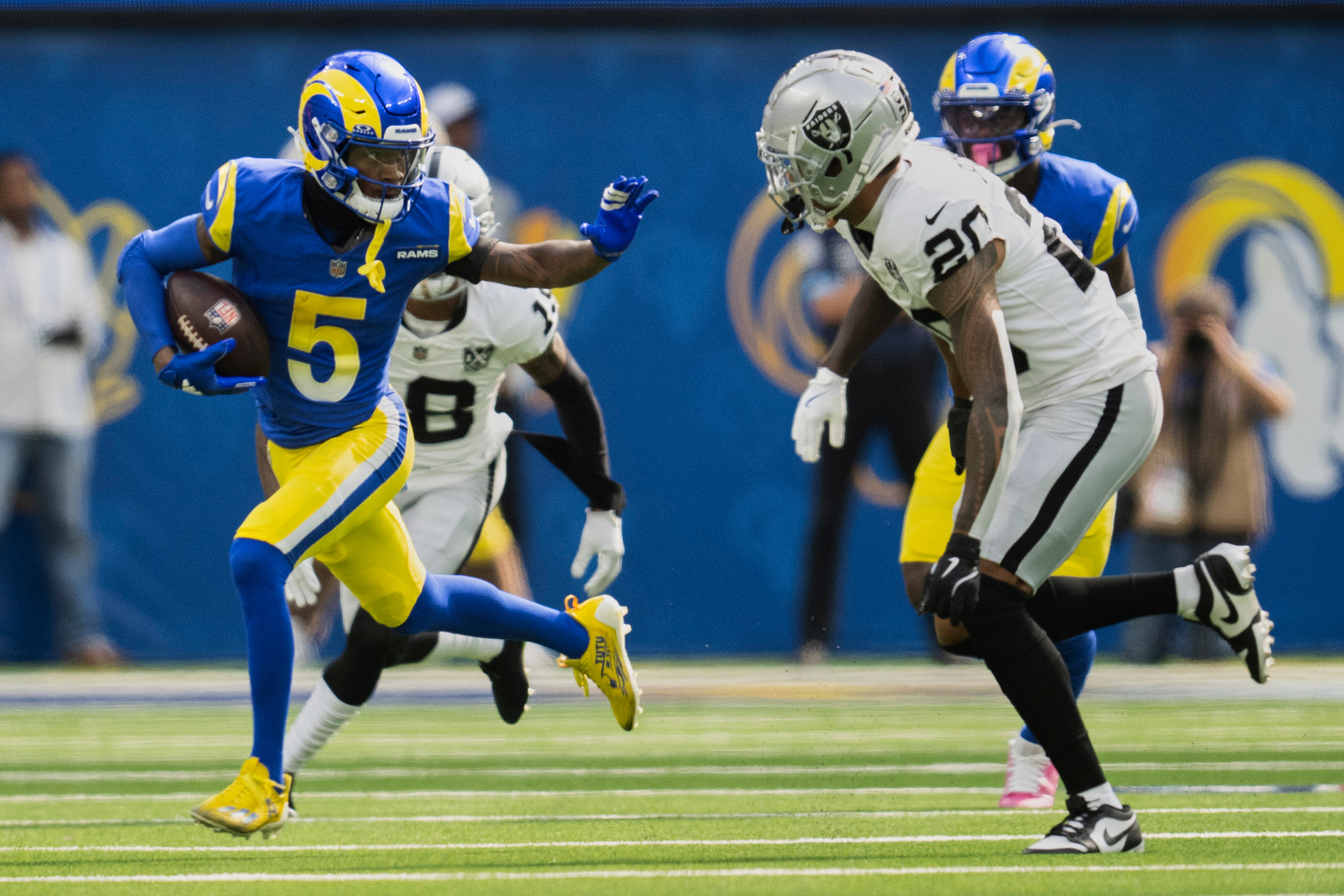 FILE - Los Angeles Rams wide receiver Tutu Atwell (5) runs with the ball as Las Vegas Raiders safety Isaiah Pola-Mao (20) chases during an NFL football game, Sunday, Oct. 20, 2024, in Inglewood, Calif.