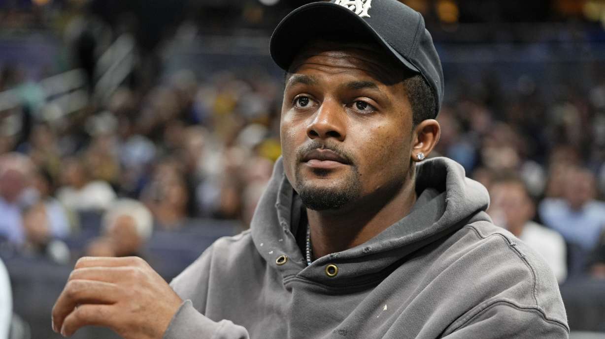 FILE - Cleveland Browns quarterback Deshaun Watson watches during the second half of an NBA basketball game between the Orlando Magic and the Golden State Warriors, Wednesday, March 27, 2024, in Orlando, Fla.