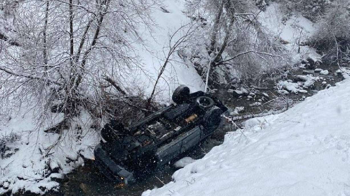 State Route 92 is closed near Provo Canyon after two vehicles slid off the road and into a small river next to the road.