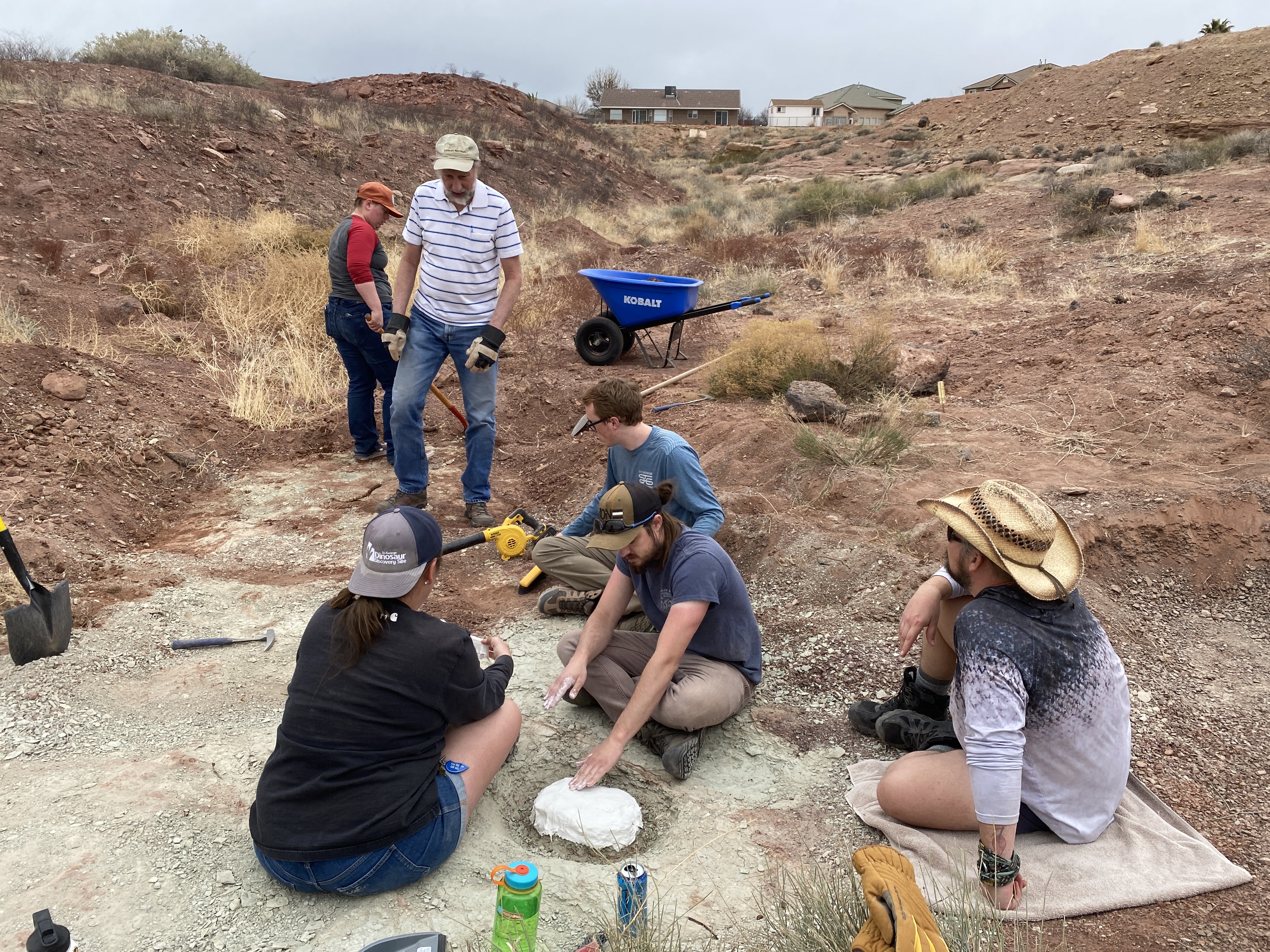 Paleontologists gather around an area where a fish fossil was found at a new dig site in St. George. The St. George Dinosaur Discovery Site is starting the dig in hopes it will reveal new insights into the state's Jurassic-era history.