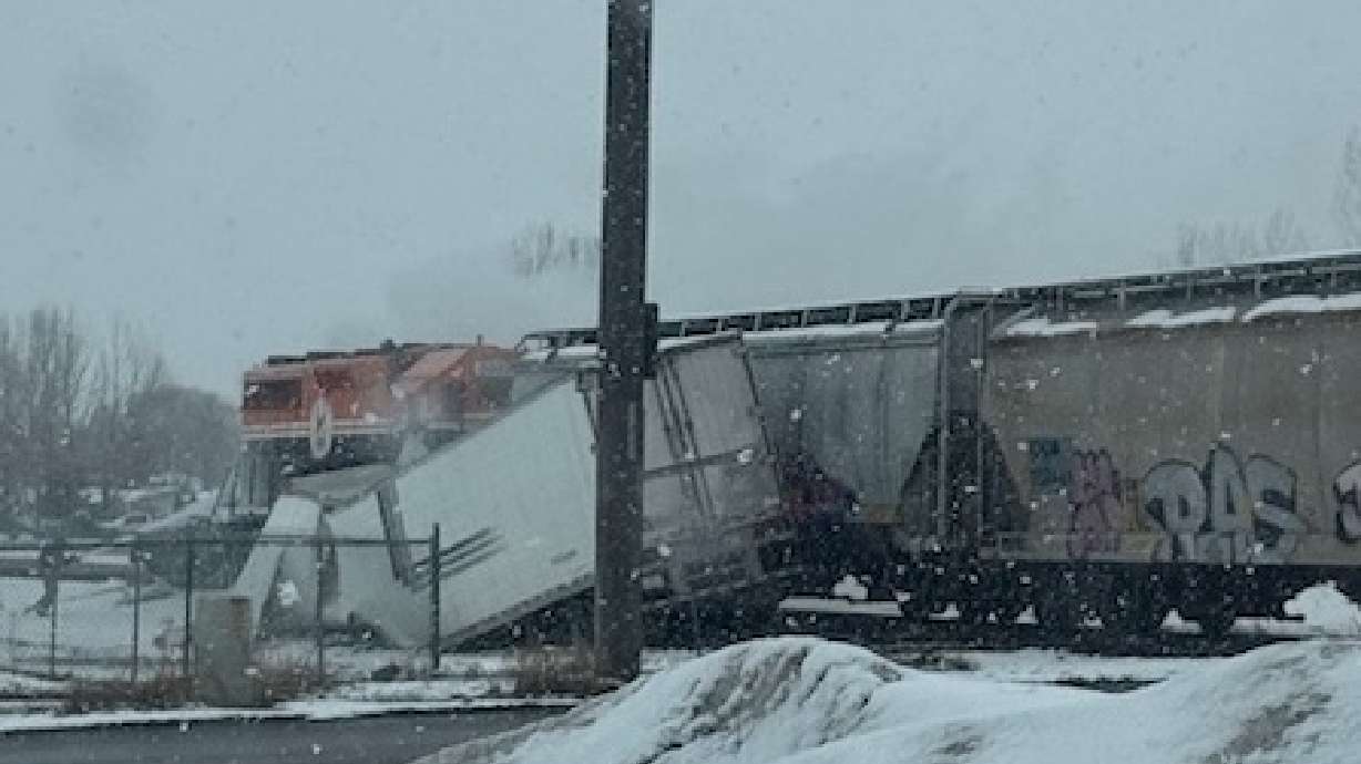 A semitruck caught fire after getting hit by a train in Sugar City, Idaho, Thursday