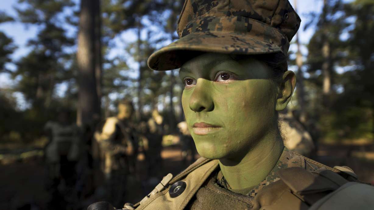 U.S. Marine Pfc. Christina Fuentes Montenegro prepares to hike to her platoon's defensive position near Camp Geiger, N.C. Oct. 31, 2013. The Defense Department is purging all diversity, equity, and inclusion content from its platforms, it announced Friday.