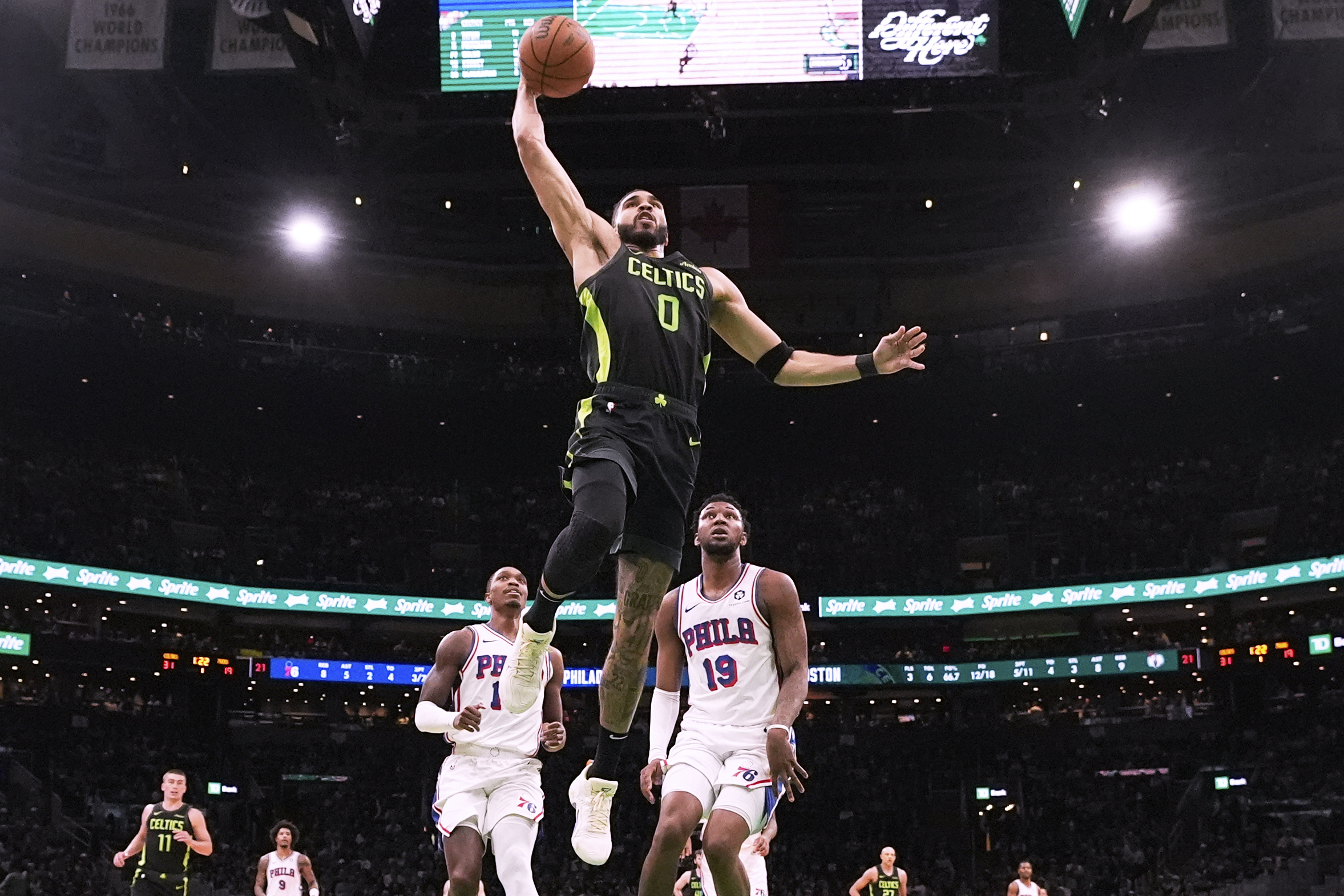 Tatum scores 35 to carry load for short-handed Celtics in 123-105 win over 76ers