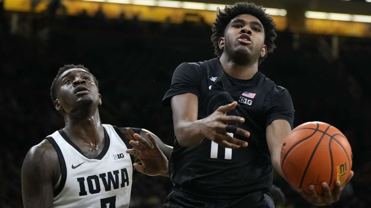 Michigan State guard Jase Richardson (11) drives past Iowa forward Seydou Traore (7) during the first half of an NCAA college basketball game, Thursday, March 6, 2025, in Iowa City, Iowa.