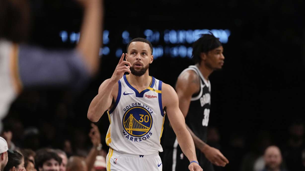 Golden State Warriors' Stephen Curry (30) gestures after making a three-point shot during the first half of an NBA basketball game against the Brooklyn Nets Thursday, March 6, 2025, in New York.