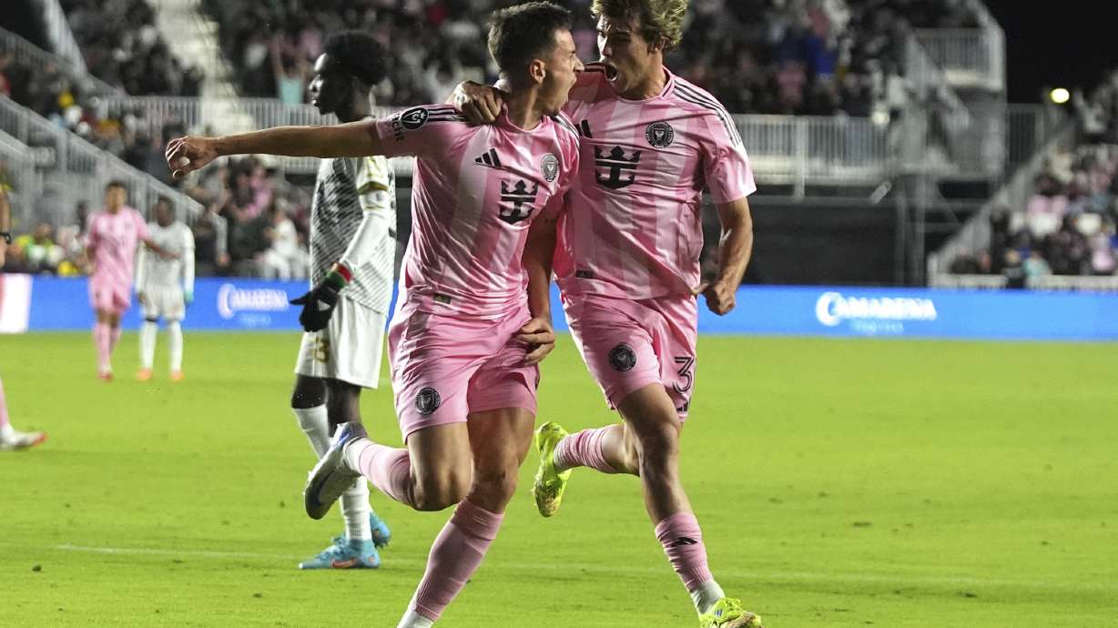 Inter Miami forward Tadeo Allende, left, celebrates with midfielder Benjamin Cremaschi, right, after scoring a goal during the second half of a CONCACAF Champions Cup soccer match against Cavalier Thursday, March 6, 2025, in Fort Lauderdale, Fla.