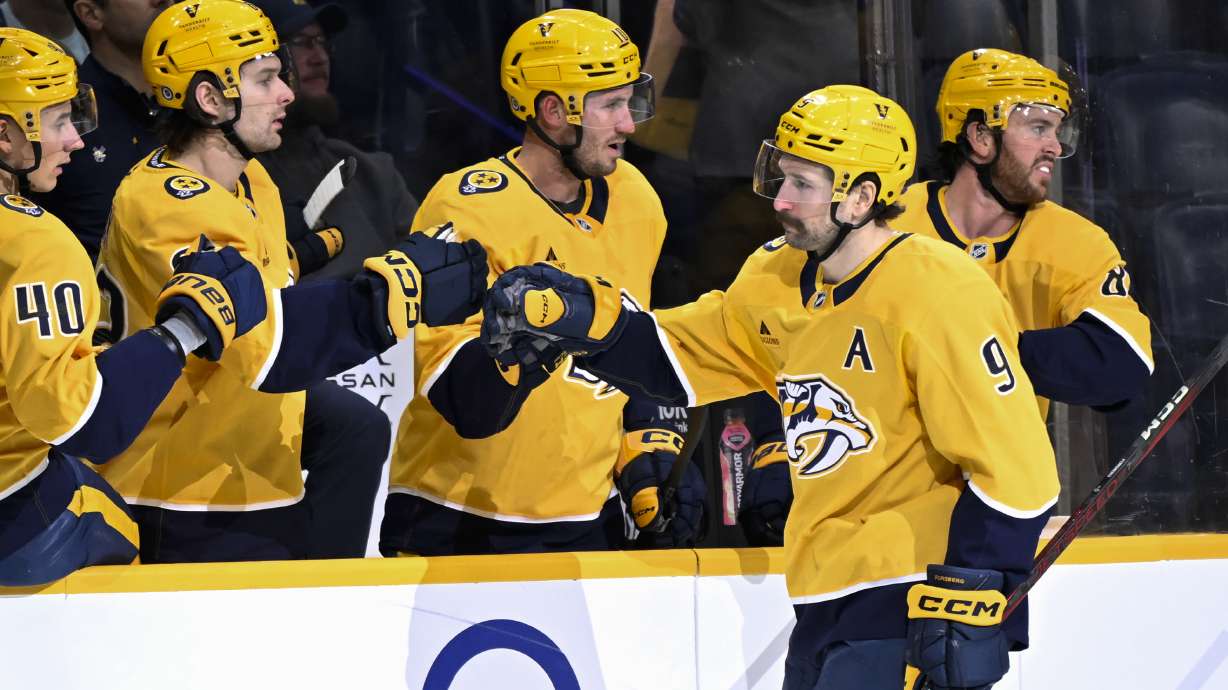Nashville Predators left wing Filip Forsberg (9) is congratulated for his goal against the Winnipeg Jets during the first period of an NHL hockey game Thursday, Feb. 27, 2025, in Nashville, Tenn.