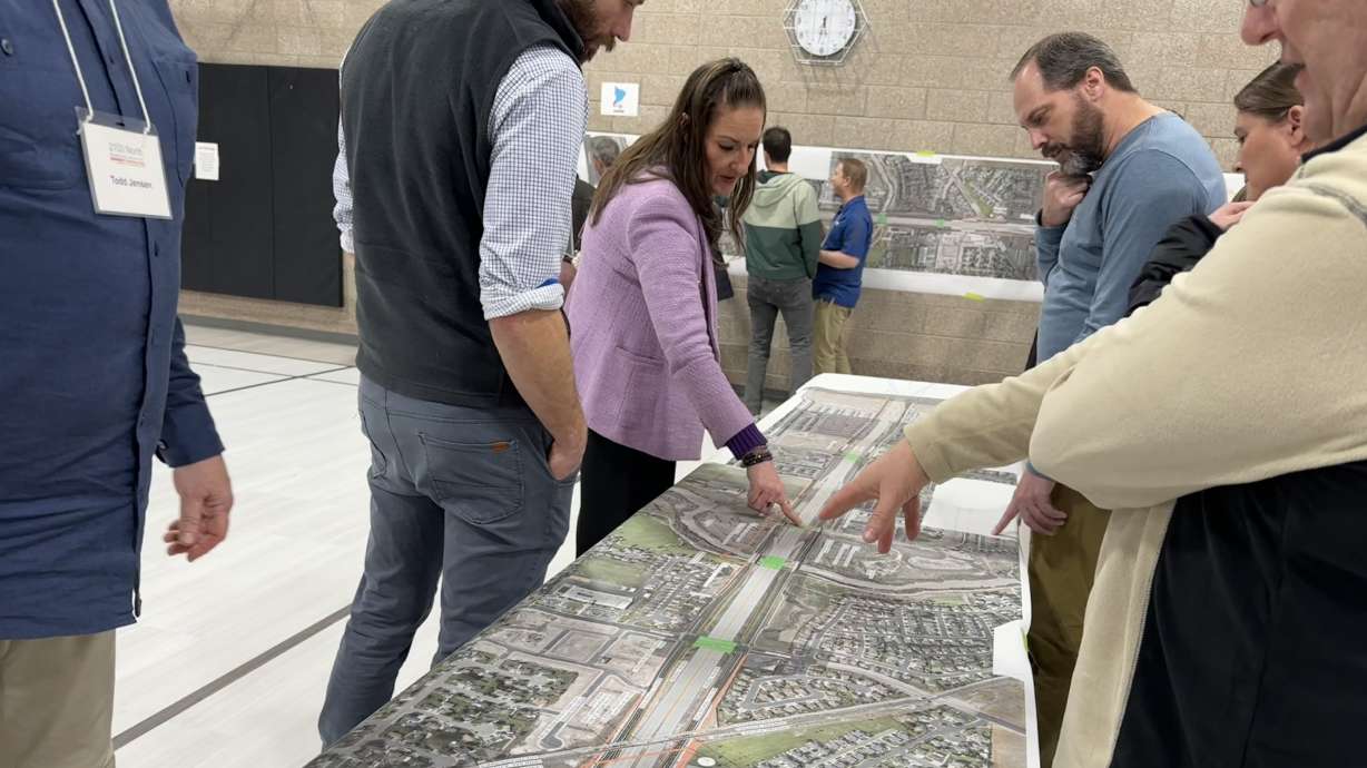 Utah County residents talk to UDOT employees at a public hearing at Liberty Hills Elementary on Thursday, March 6.