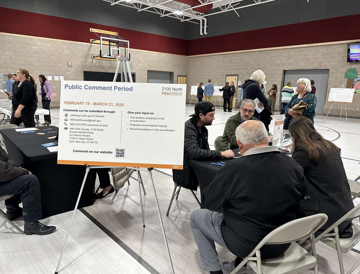 Utah County residents talk to UDOT employees at a public hearing at Liberty Hills Elementary on March 6.