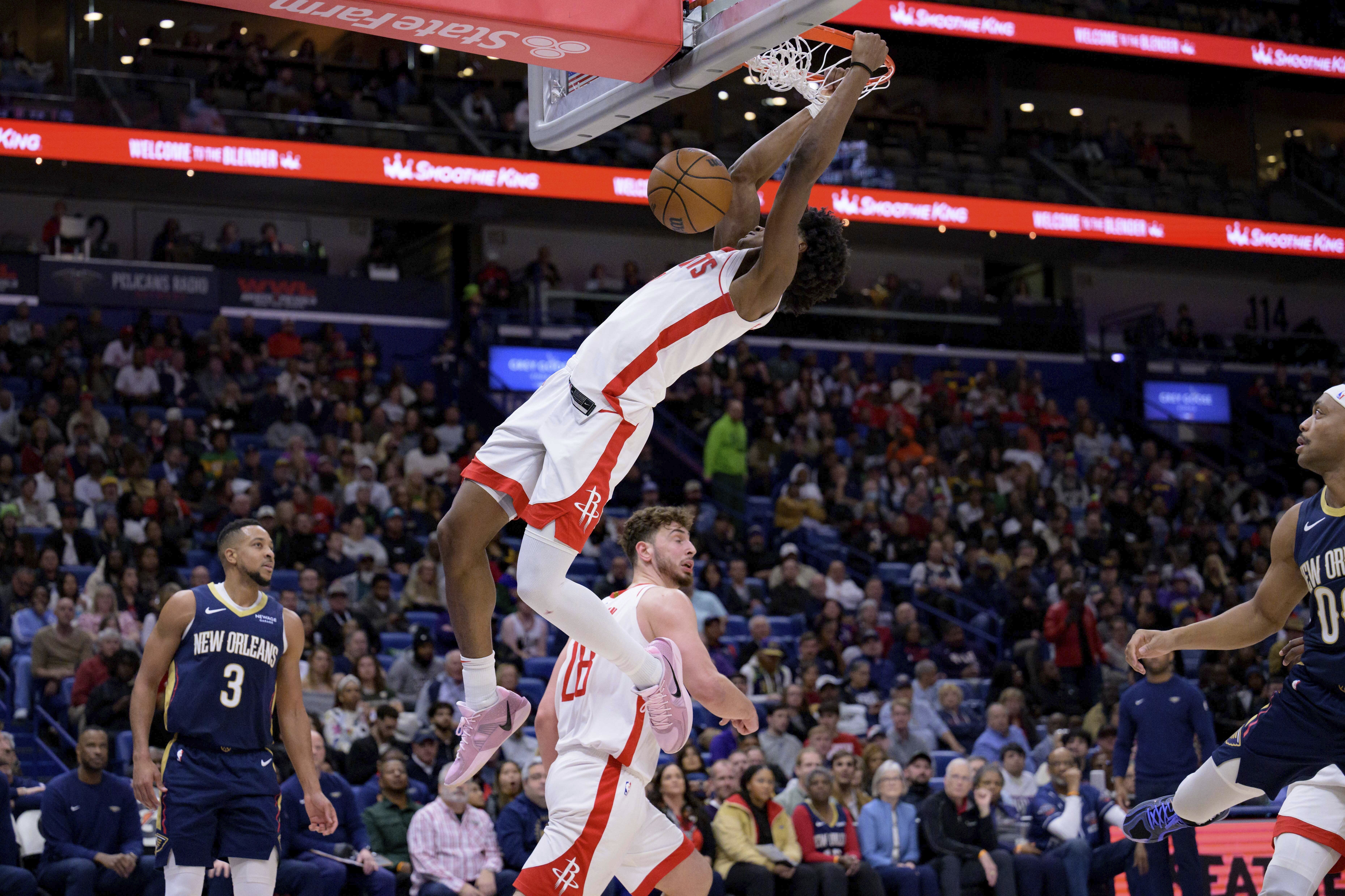 Houston Rockets forward Amen Thompson (1) dunks against the New Orleans Pelicans during the first half of an NBA basketball game in New Orleans, Thursday, March 6, 2025.  - AP Photo/Matthew Hinton