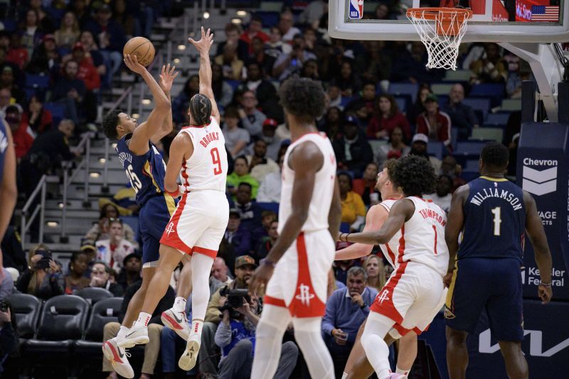 New Orleans Pelicans guard Trey Murphy III (25) shoots against Houston Rockets forward Dillon Brooks (9) during the first half of an NBA basketball game in New Orleans, Thursday, March 6, 2025. - AP Photo/Matthew Hinton