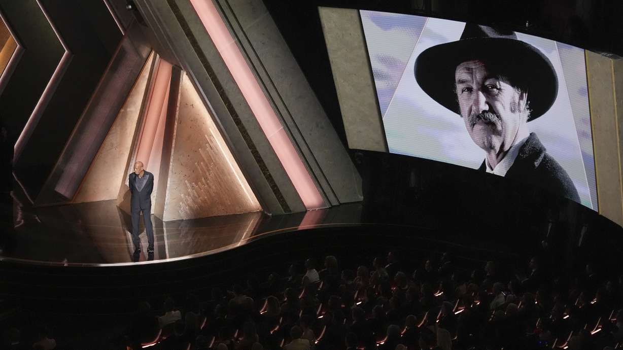 Morgan Freeman speaks about Gene Hackman during the Oscars on Sunday at the Dolby Theatre in Los Angeles. Officials said Friday that Hackman died of heart disease a week after his wife died of hantavirus at home.