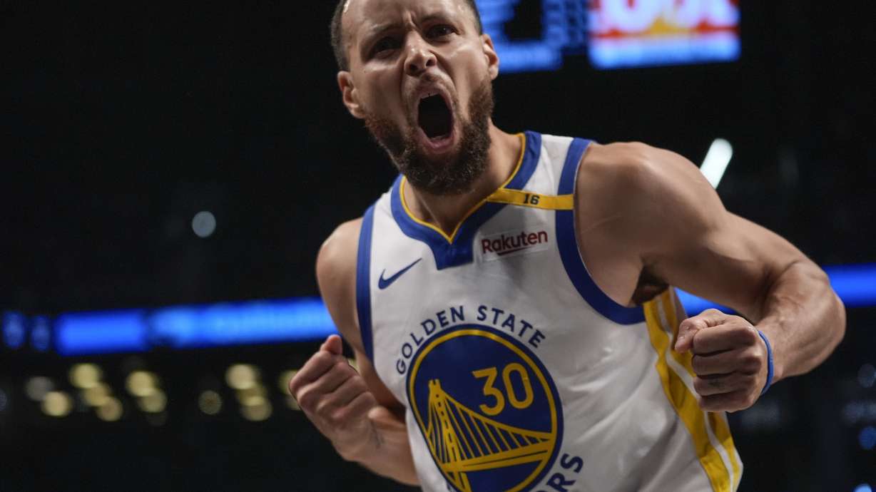 Golden State Warriors' Stephen Curry (30) celebrates after making a three-point shot during the second half of an NBA basketball game against the Brooklyn Nets Thursday, March 6, 2025, in New York.