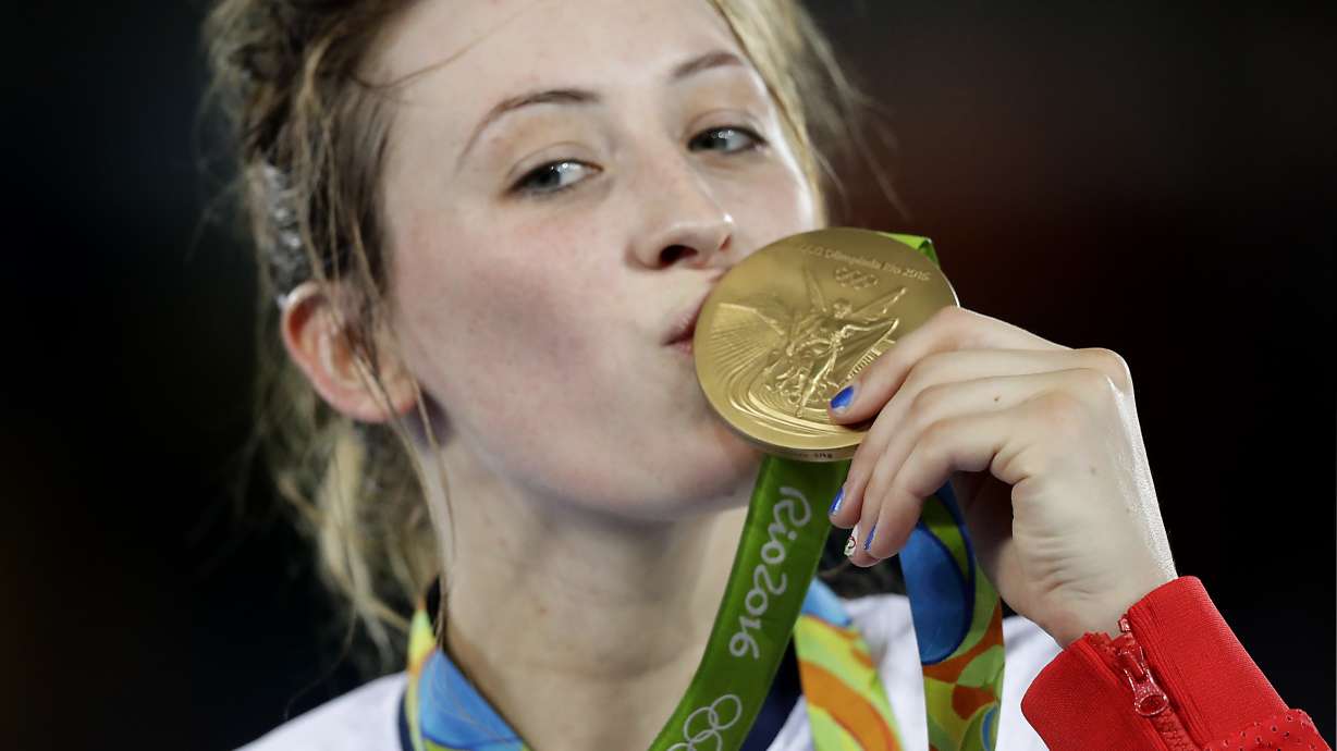 FILE - Jade Jones, of Britain, kisses her gold medal in women's 57-kg taekwondo at the 2016 Summer Olympics in Rio de Janeiro, Brazil, Thursday, Aug. 18, 2016.