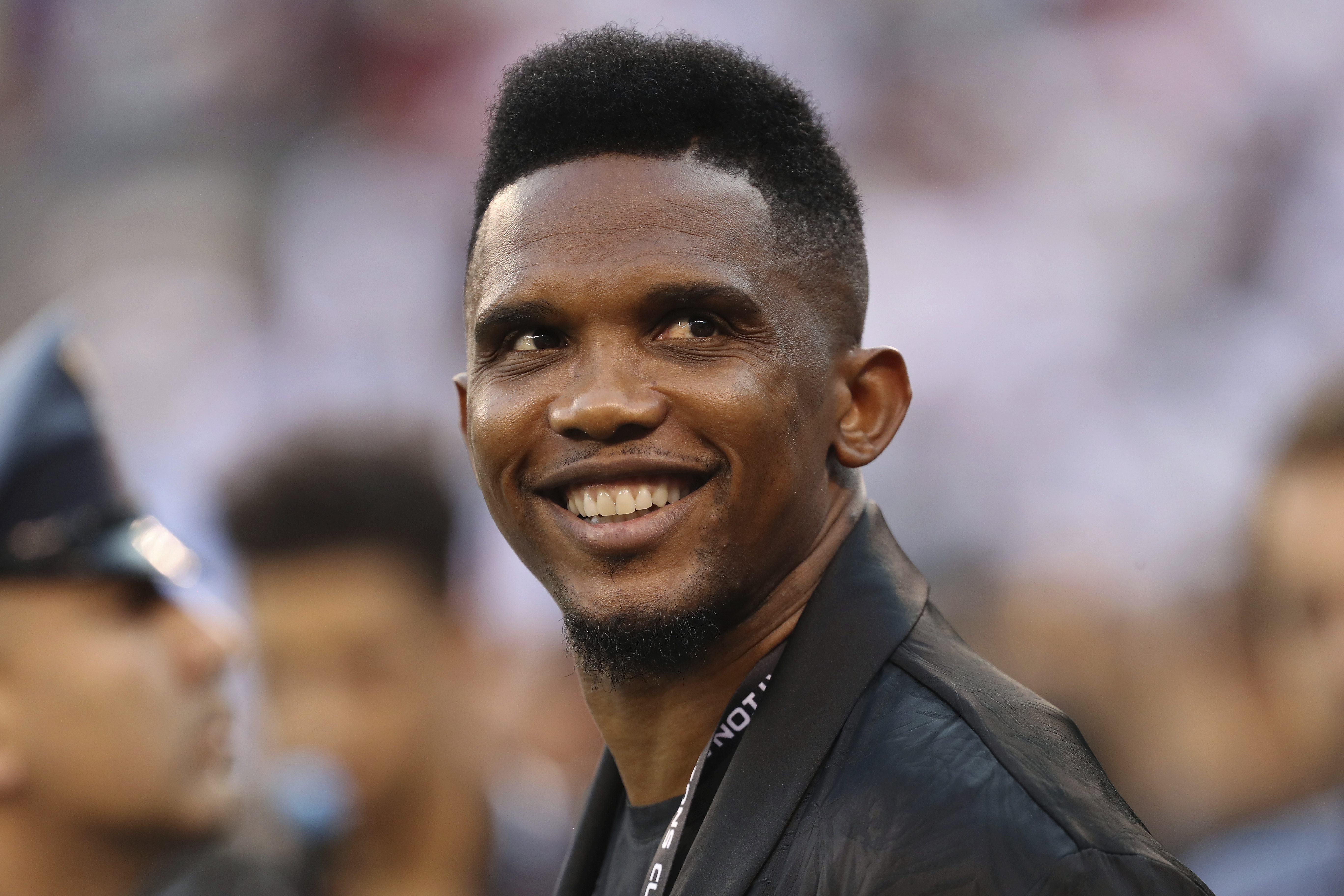 FILE - Soccer player Samuel Eto'o watches warmups before an International Champions Cup soccer match between Atletico Madrid and Real Madrid, July 26, 2019, in East Rutherford, N.J. 