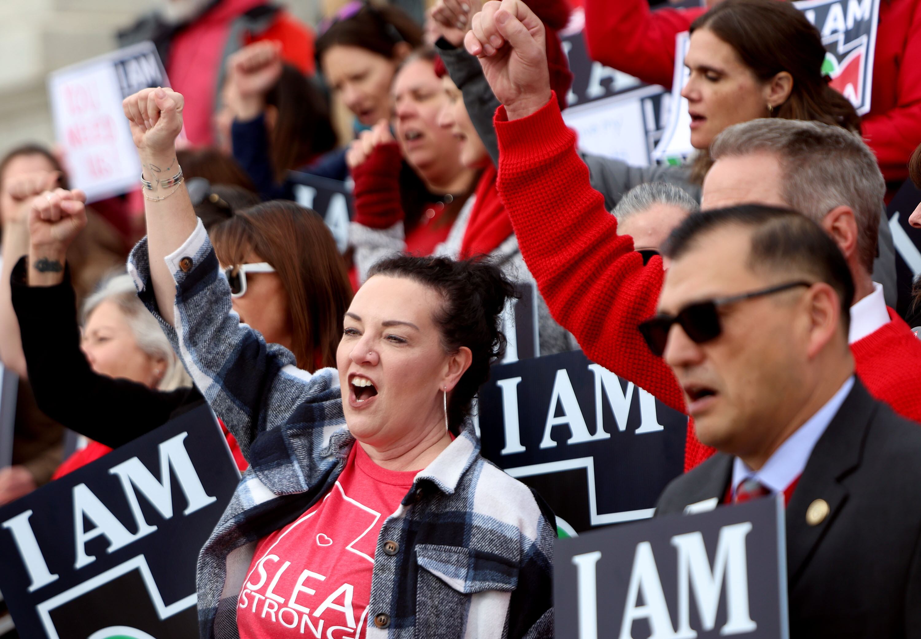 Chelsie Acosta, Salt Lake Education Association vice president, cheers with other educators and union members in opposition to HB267: Public Sector Labor Union Amendments, at the Capitol in Salt Lake City on Jan. 31.