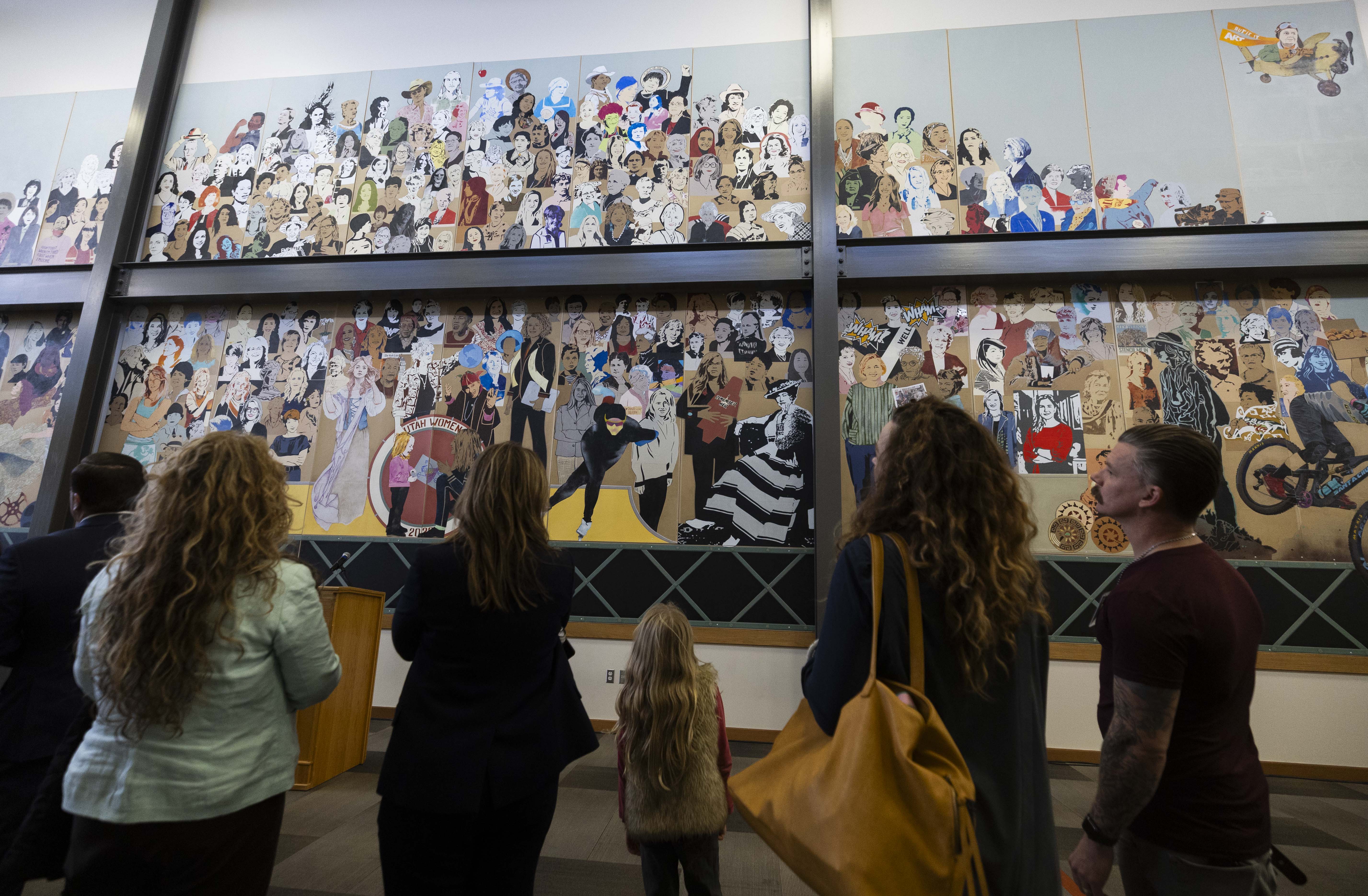 People look at the Utah Women Mural during its unveiling at Salt Lake Community College’s South City Campus in Salt Lake City on Thursday.