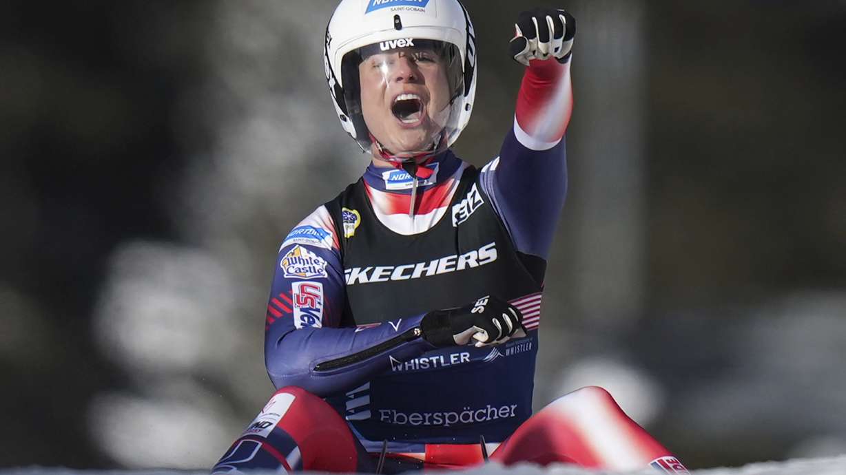 Emily Sweeney, of the U.S., celebrates after she and Jonathan Eric Gustafson, not seen, raced to a second-place finish during the mixed singles event at the Luge World Championships, in Whistler, B.C., on Thursday, Feb. 6, 2025.