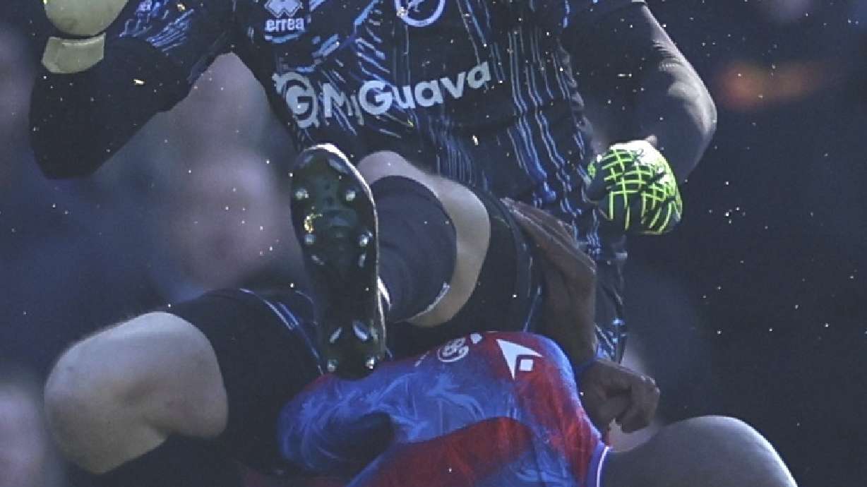 Crystal Palace's Jean-Philippe Mateta is fouled by Millwall goalkeeper Liam Roberts, for which he got a red card, during the English FA Cup soccer match between Crystal Palace and Millwall at Selhurst Park, London, England, Saturday, March 1, 2025.