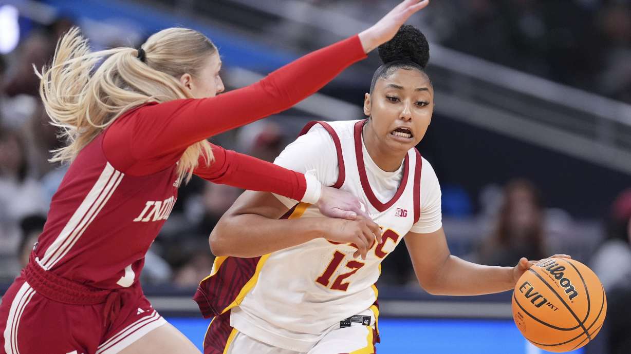Indiana guard Lexus Bargesser (1) defends Southern California guard JuJu Watkins (12) in the first half of an NCAA college basketball game in the quarterfinals of the Big Ten Conference tournament in Indianapolis, Friday, March 7, 2025.