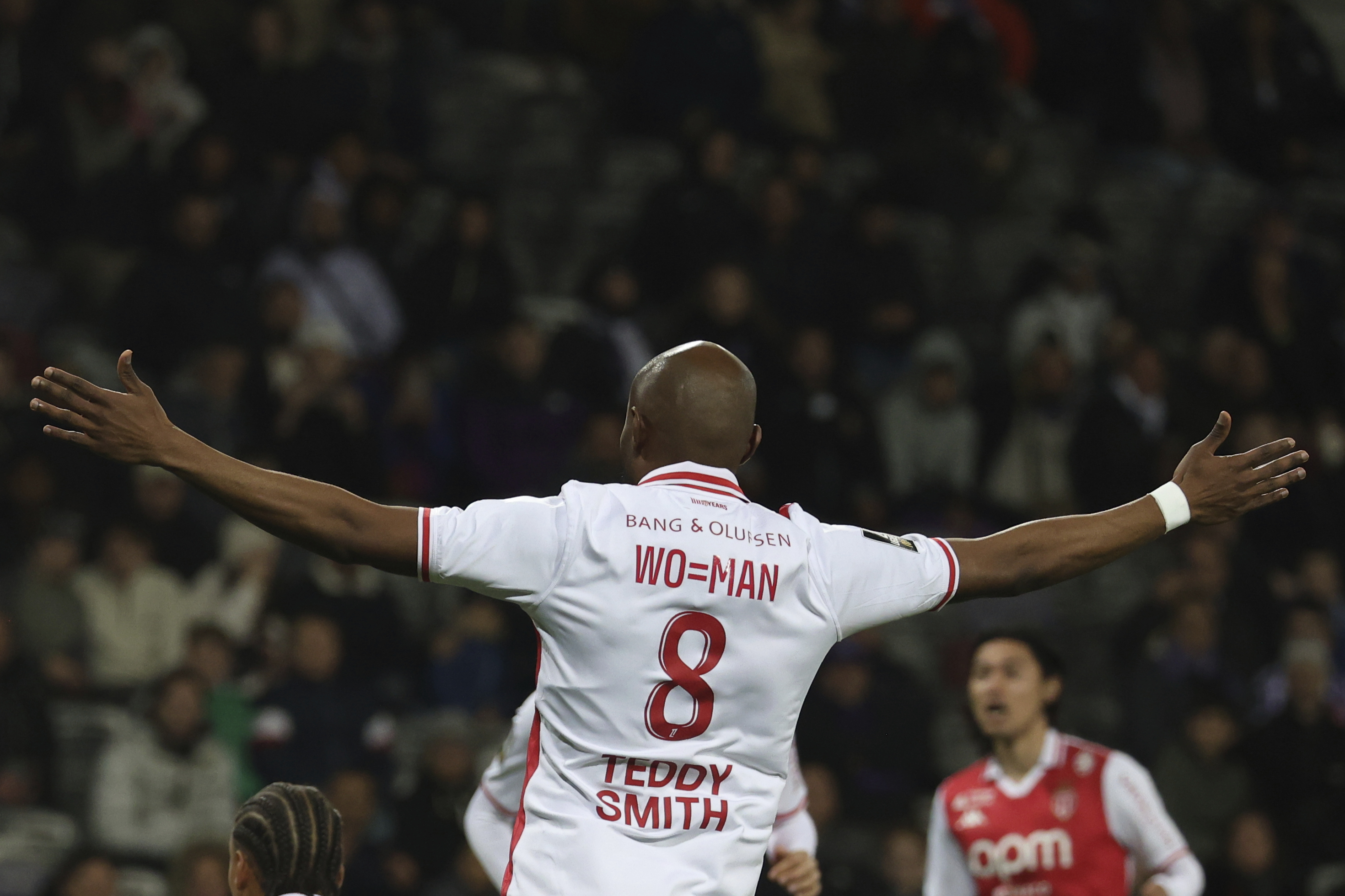 Monaco's Almoatasembellah Ali Musrati, wearing a jersey for International Women's Day, reacts during the French League One soccer match between Toulouse and Monaco Friday, March 7, 2025 at the Toulouse stadium, southwestern France.