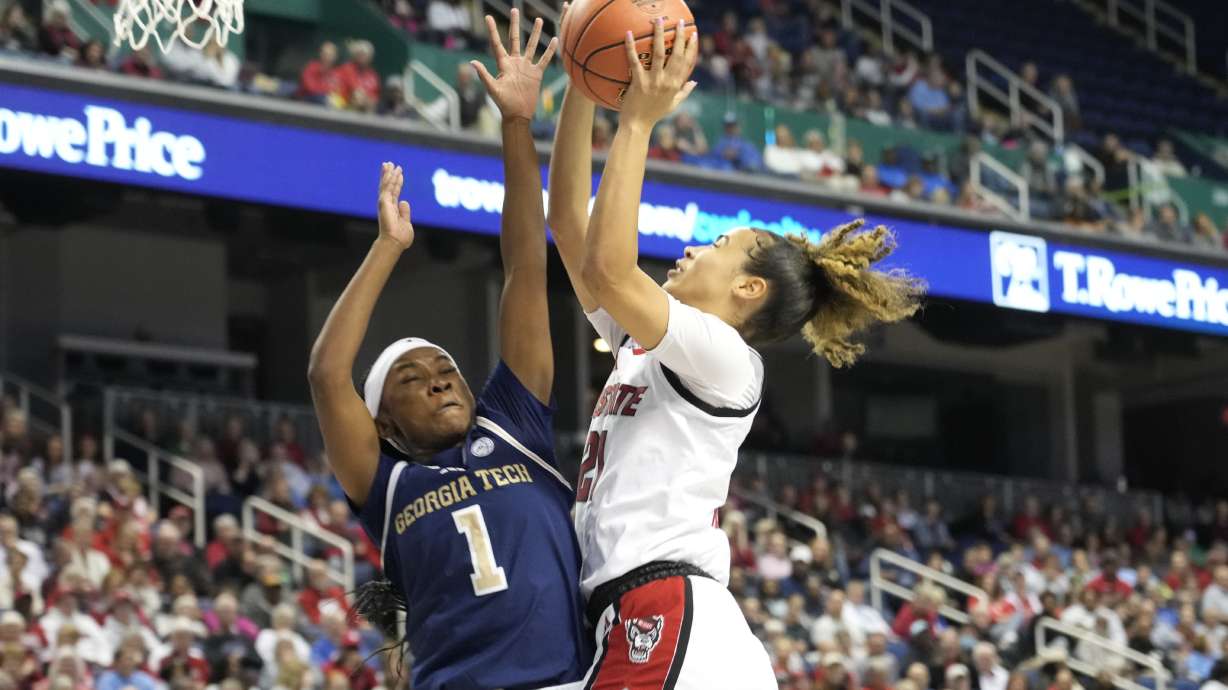 North Carolina State guard Madison Hayes (21) shoot over Georgia Tech guard Chazadi Wright (1) during an NCAA college basketball game in the quarterfinals of the Atlantic Coast Conference tournament Greensboro, N.C., Friday, March 7, 2025.