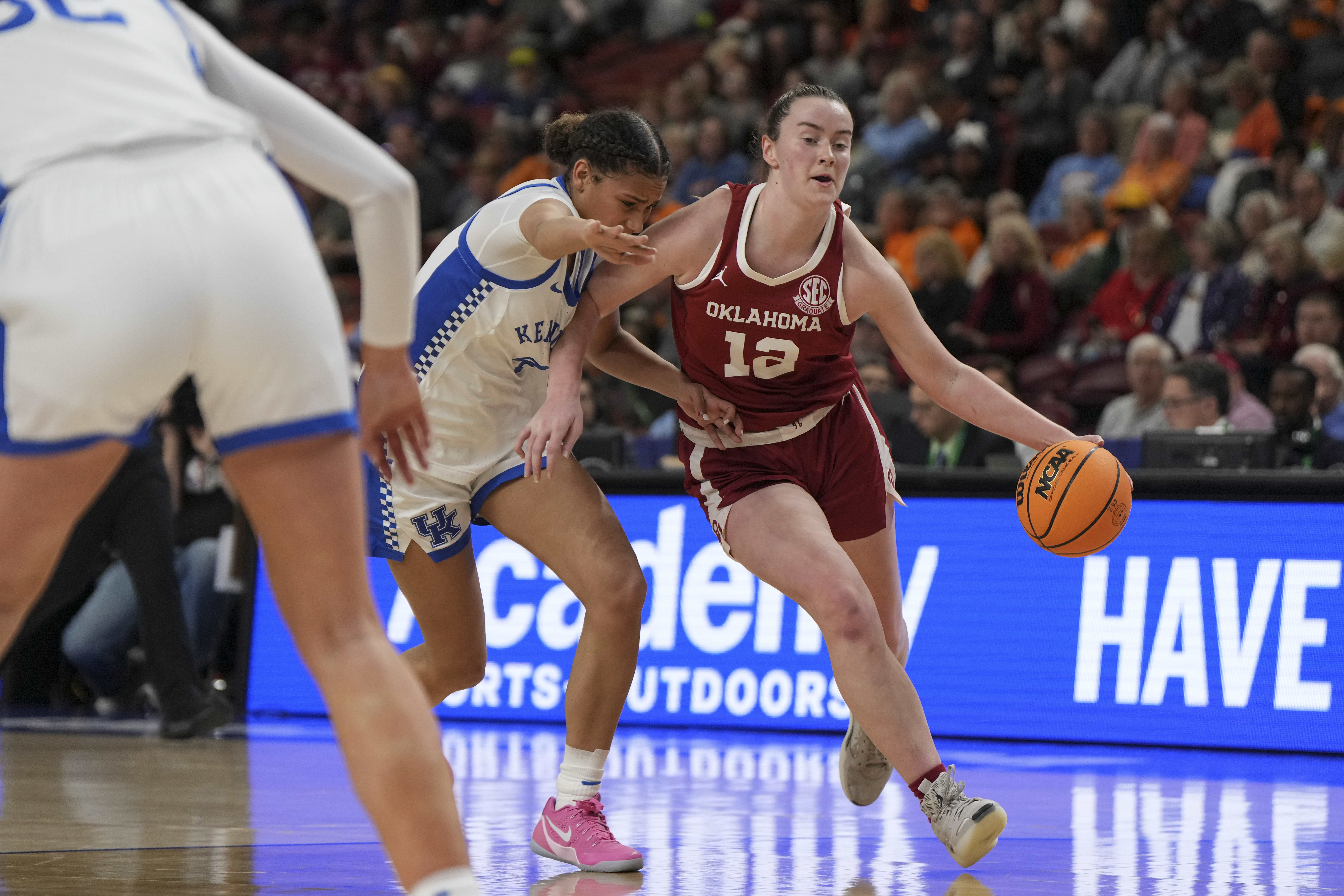 Oklahoma guard Payton Verhulst (12) drives the ball around a Kentucky defender during an NCAA college basketball game in the quarterfinals of the Southeastern Conference tournament, Friday, March 7, 2025, in Greenville, S.C. 