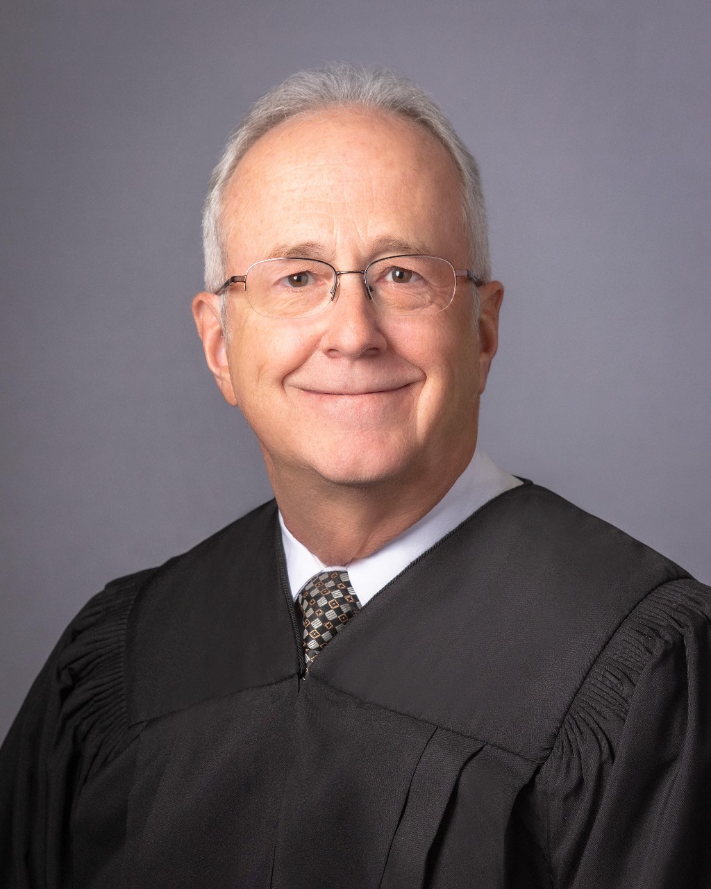 First District Justice Court Judge Kevin Christensen was arrested Thursday and accused of enticing minors through sexual conversations on a chat app.