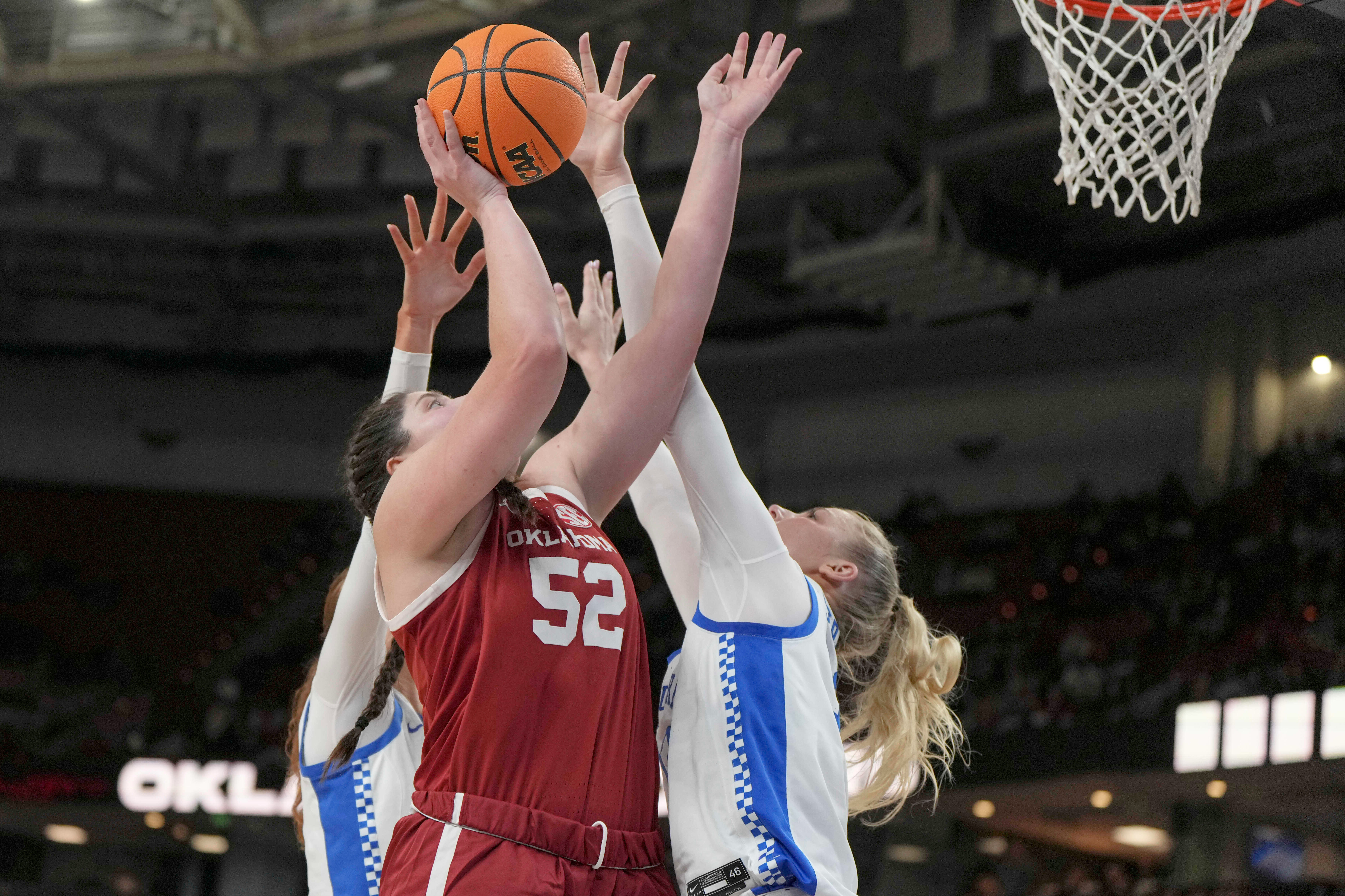 Oklahoma center Raegan Beers (52) shoots over Kentucky defenders during an NCAA college basketball game in the quarterfinals of the Southeastern Conference tournament, Friday, March 7, 2025, in Greenville, S.C. 