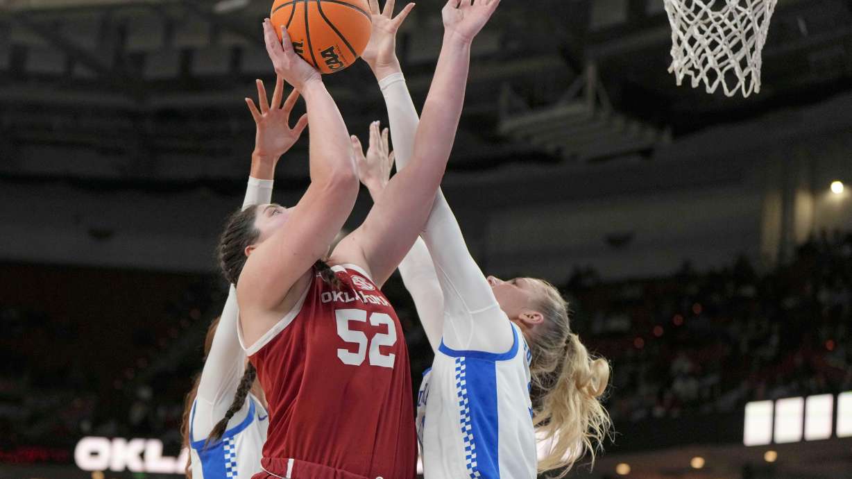 Oklahoma center Raegan Beers (52) shoots over Kentucky defenders during an NCAA college basketball game in the quarterfinals of the Southeastern Conference tournament, Friday, March 7, 2025, in Greenville, S.C.