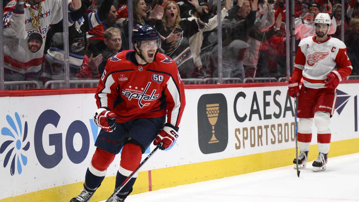 Washington Capitals right wing Taylor Raddysh, left, celebrates after scoring against the Detroit Red Wings during the first period of an NHL hockey game, Friday, March 7, 2025, in Washington.