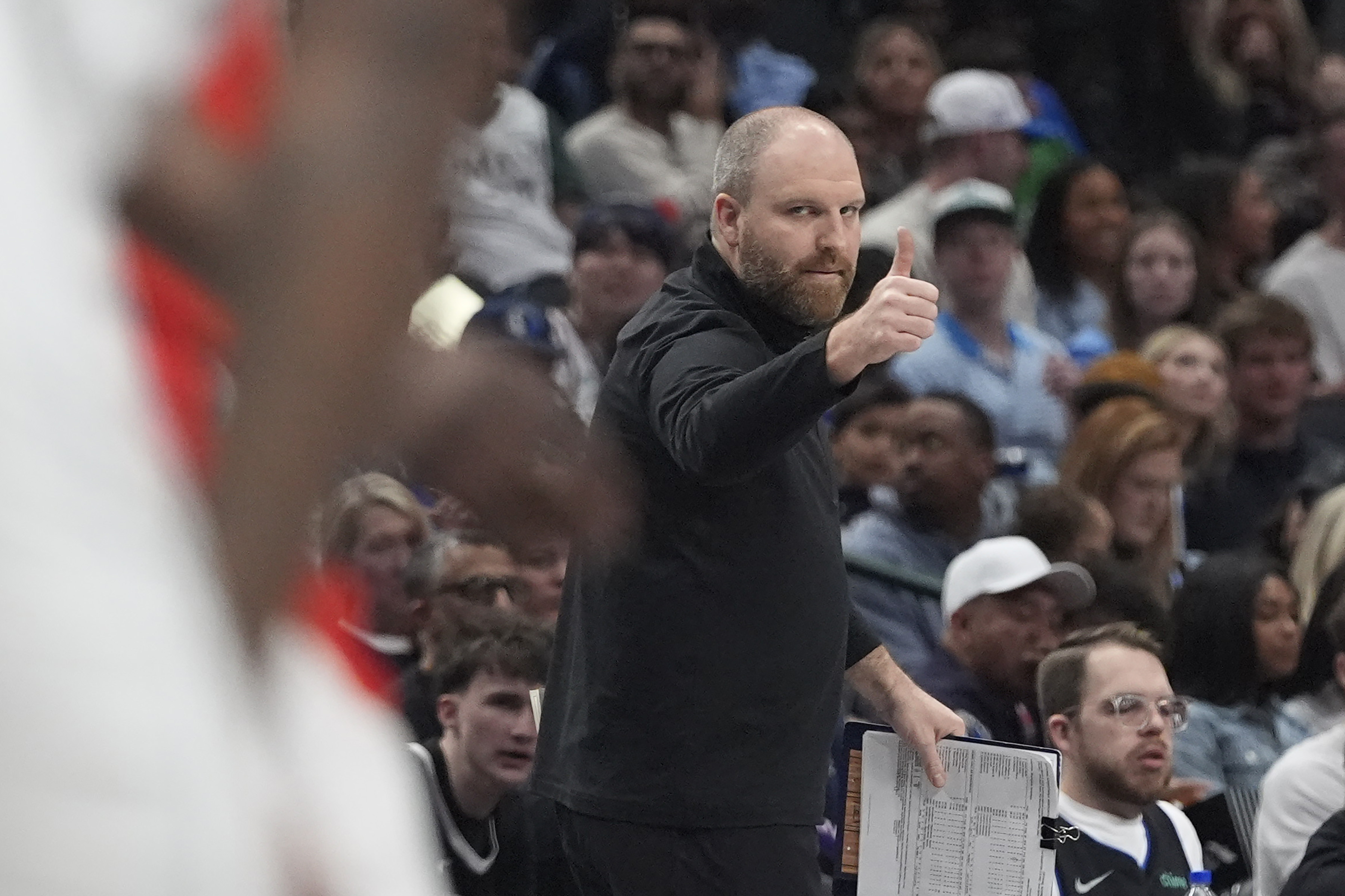 Memphis Grizzlies head coach Taylor Jenkins gestures from a sideline during the first half of an NBA basketball game against the Dallas Mavericks in Dallas, Friday, March 7, 2025. 