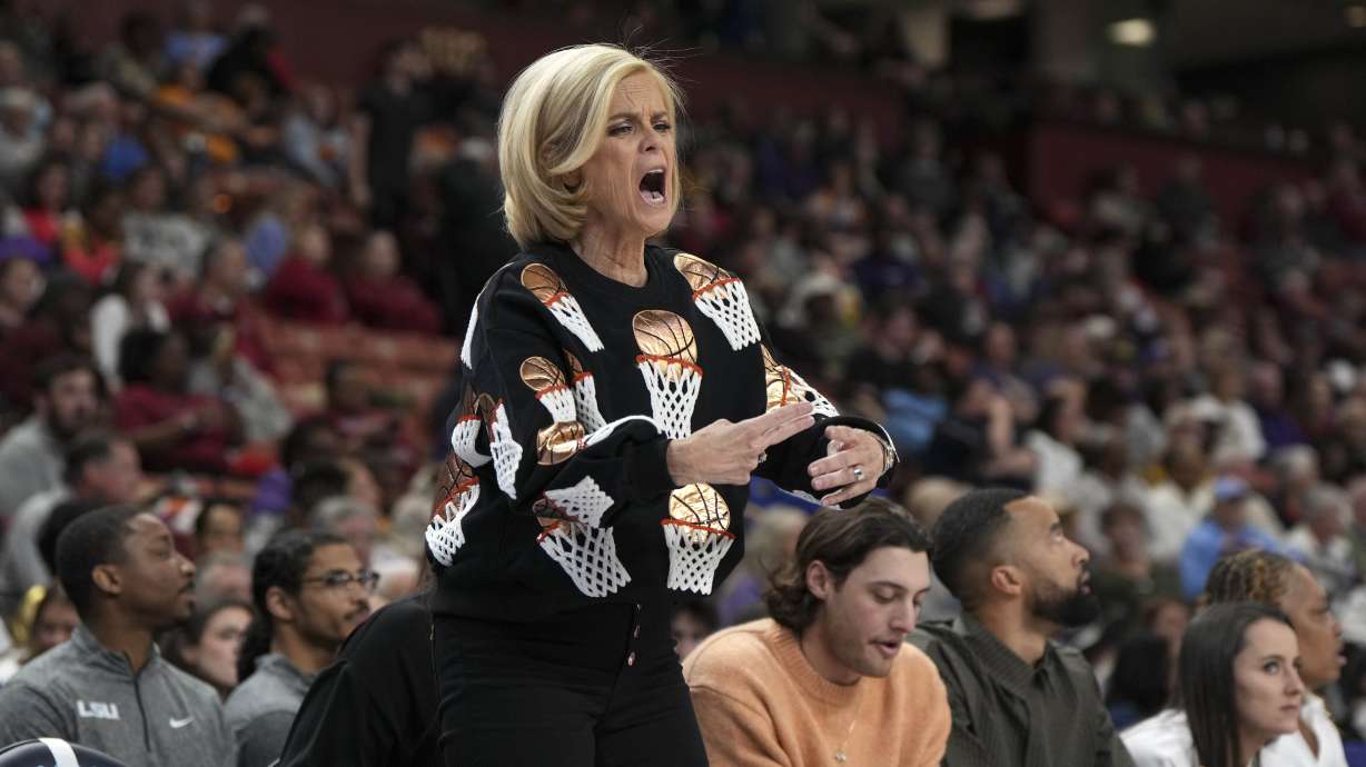 LSU head coach Kim Mulkey makes a traveling gesture during an NCAA college basketball against Florida game in the quarterfinals of the Southeastern Conference tournament, Friday, March 7, 2025, in Greenville, S.C.