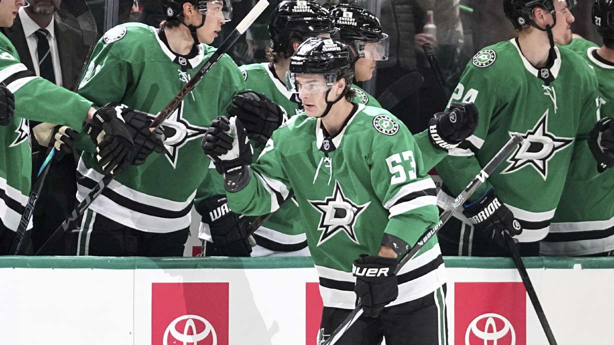 Dallas Stars center Wyatt Johnston (53) celebrates with the bench after scoring against the Calgary Flames in the second period of an NHL hockey game in Dallas, Thursday, March 6, 2025.