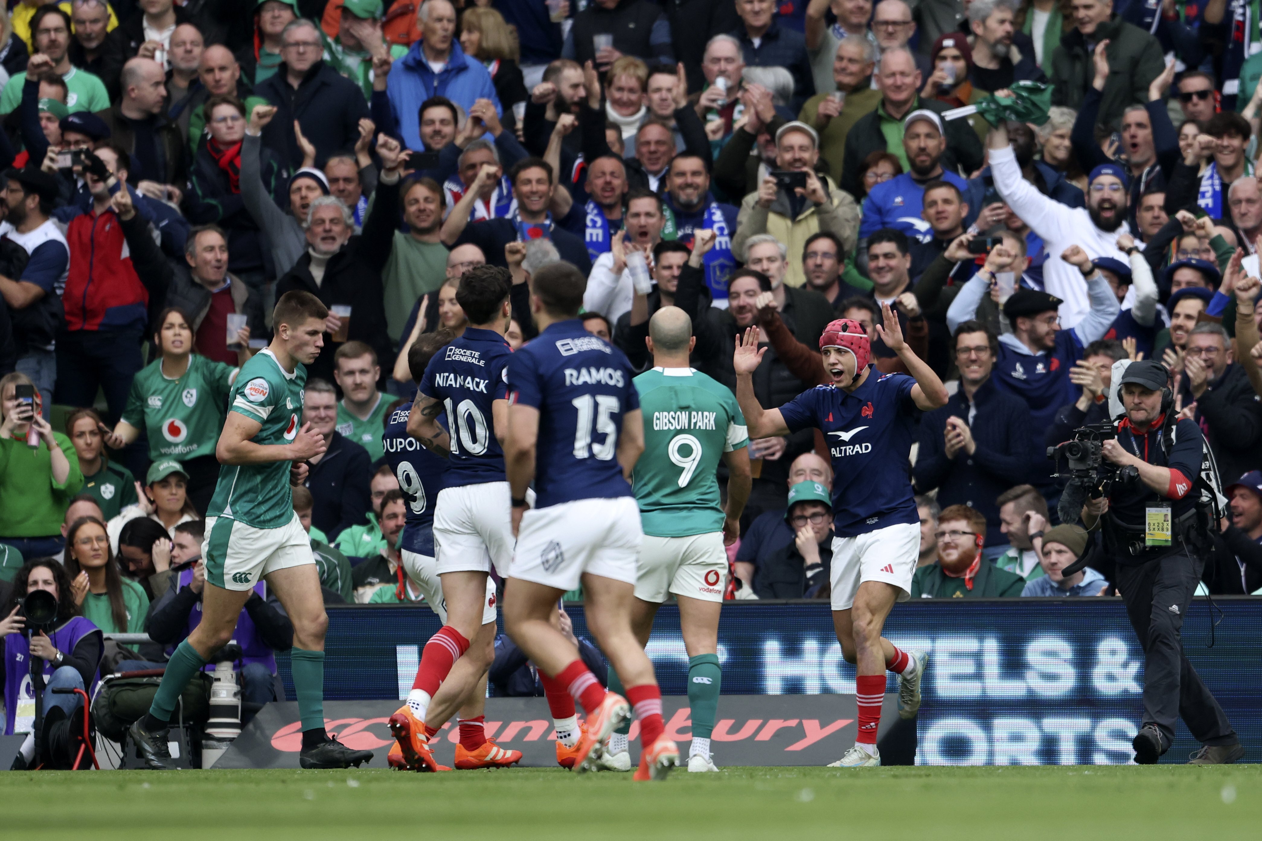 France's Louis Bielle-Biarrey, right, celebrates with his teammates after scoring a try during the Six Nations rugby union match between Ireland and France, at Aviva Stadium, Dublin, Ireland, Saturday, March 8, 2025. 