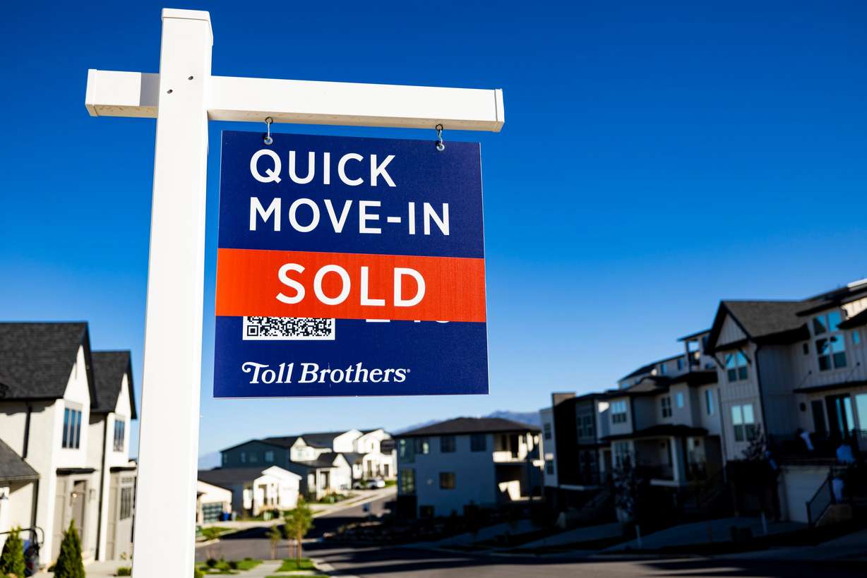 A “For Sale” sign stands among homes in North Salt Lake on Sept. 25, 2024.