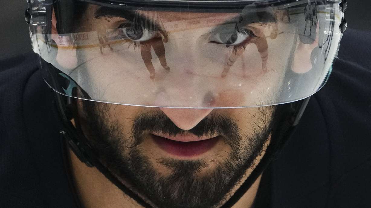 Seattle Kraken center Matty Beniers looks on during a face-off against the Toronto Maple Leafs during the second period of an NHL hockey game Thursday, Feb. 6, 2025, in Seattle.