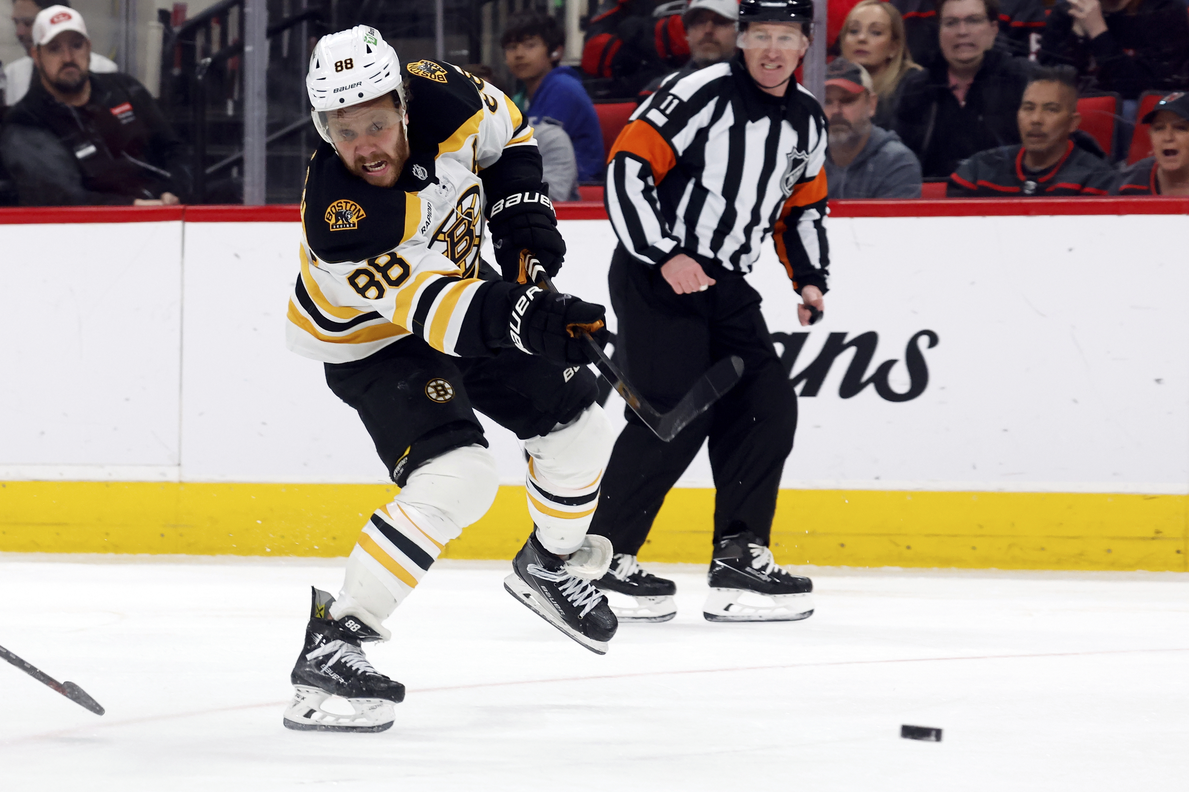Boston Bruins' David Pastrnak (88) shoots against the Carolina Hurricanes during the third period of an NHL hockey game in Raleigh, N.C., Thursday, March 6, 2025.