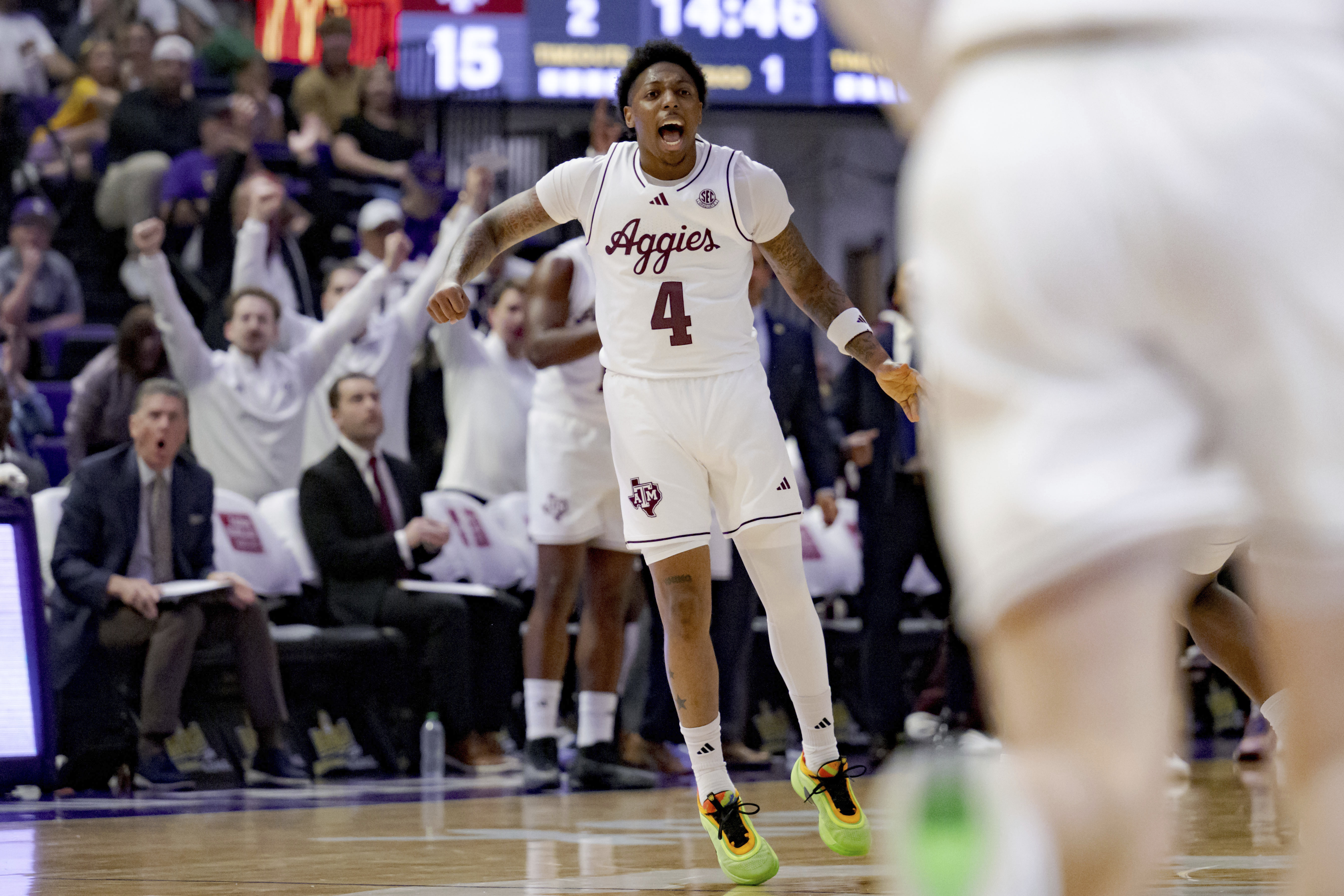 Texas A&M guard Wade Taylor IV (4) reacts after a three-point basket against LSU during the first half of an NCAA college basketball game in Baton Rouge, La., Saturday, March 8, 2025.