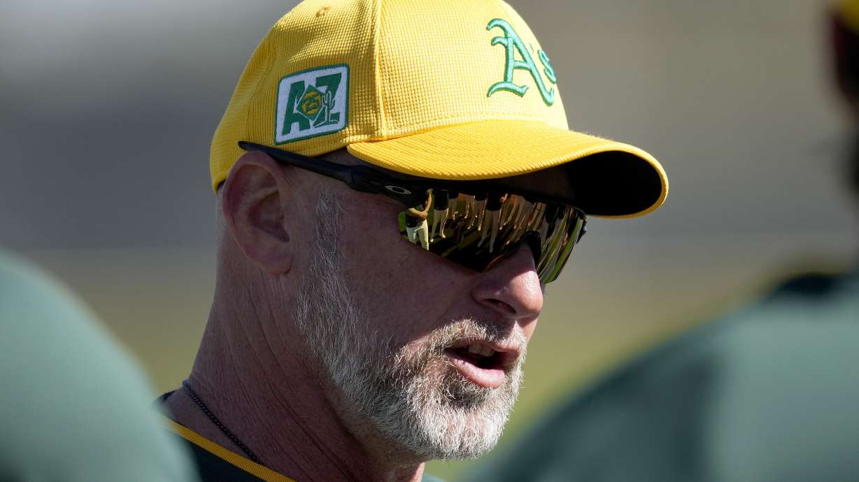 Athletics manager Mark Kotsay talks with players during a spring training baseball workout, Friday, Feb. 21, 2025, in Mesa, Ariz.