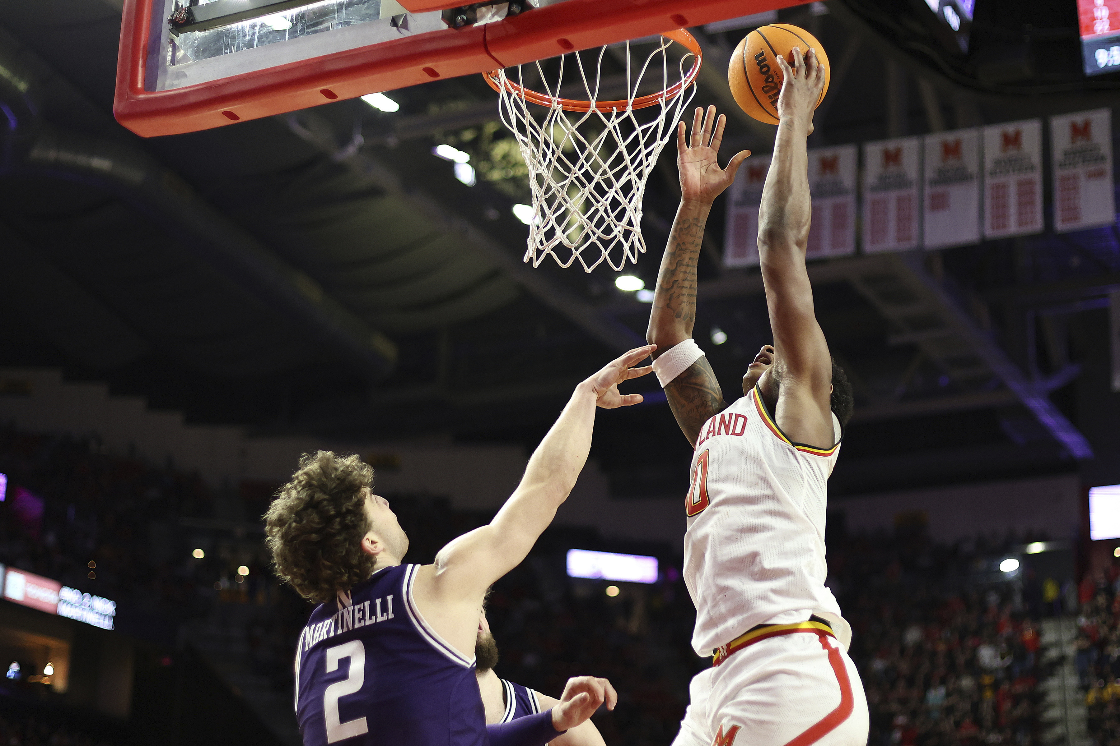 Maryland forward Julian Reese (10) takes a shot over Northwestern forward Nick Martinelli (2) during the second half of an NCAA college basketball game, Saturday, March 8, 2025, in College Park, Md. 