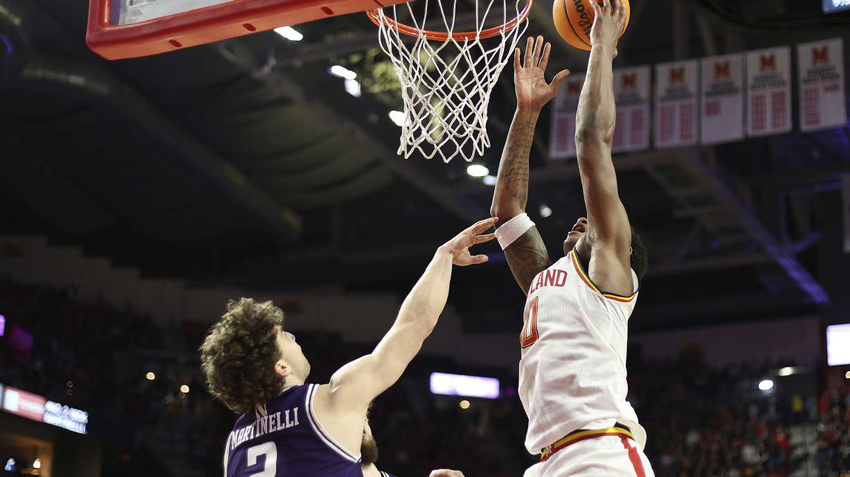 Maryland forward Julian Reese (10) takes a shot over Northwestern forward Nick Martinelli (2) during the second half of an NCAA college basketball game, Saturday, March 8, 2025, in College Park, Md.