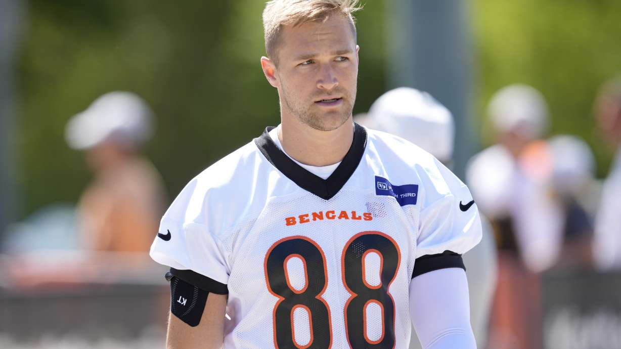 FILE - Cincinnati Bengals tight end Mike Gesicki walks to an NFL football practice, May 28, 2024, in Cincinnati.