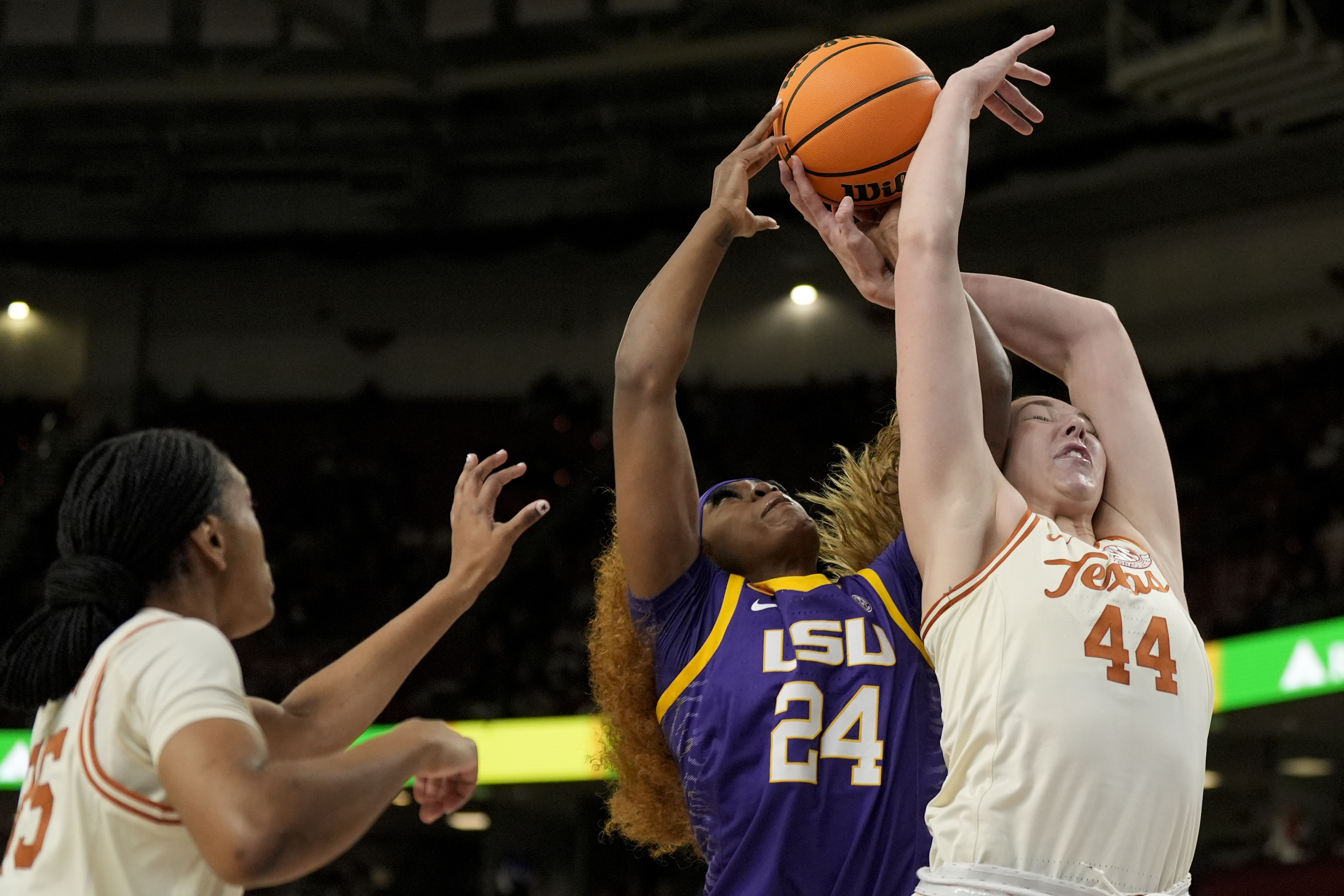 Texas forward Taylor Jones (44) vies for the ball with LSU guard Aneesah Morrow during the first half during of an NCAA college basketball game in the semifinals of the Southeastern Conference tournament, Saturday, March 8, 2025, in Greenville, S.C. 