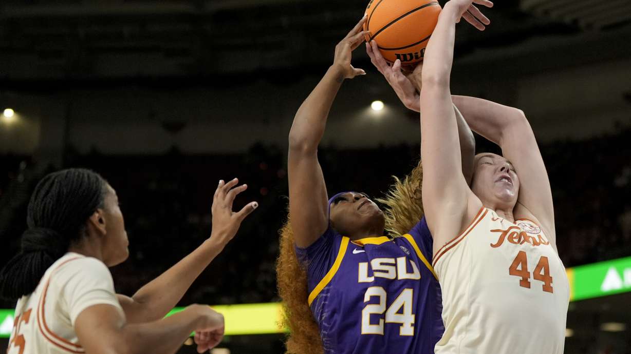 Texas forward Taylor Jones (44) vies for the ball with LSU guard Aneesah Morrow during the first half during of an NCAA college basketball game in the semifinals of the Southeastern Conference tournament, Saturday, March 8, 2025, in Greenville, S.C.