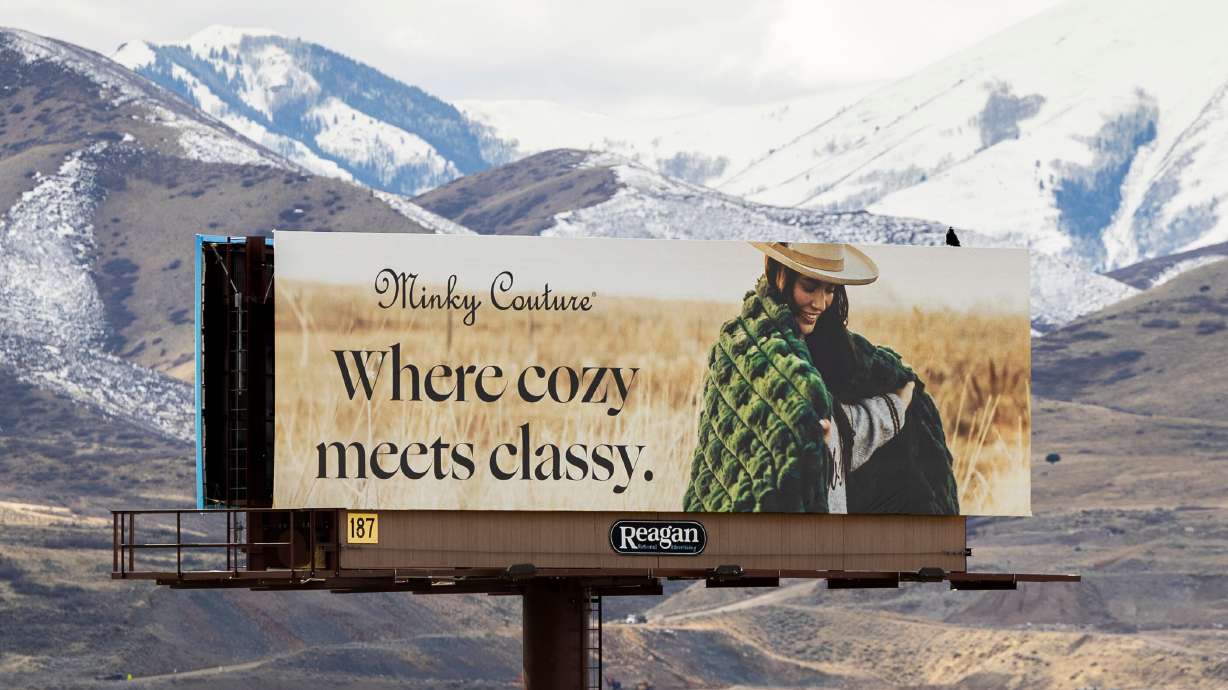 A billboard for Minky Couture is posted along I-15 in Bluffdale on March 4. Deseret News' Meg Walter did a recent analysis dividing billboards across Utah into several cultural categories.