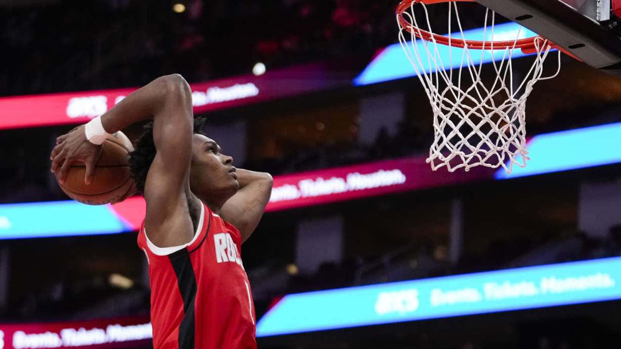Houston Rockets forward Amen Thompson (1) dunks during the first half of an NBA basketball game against the New Orleans Pelicans in Houston, Saturday, March 8, 2025.