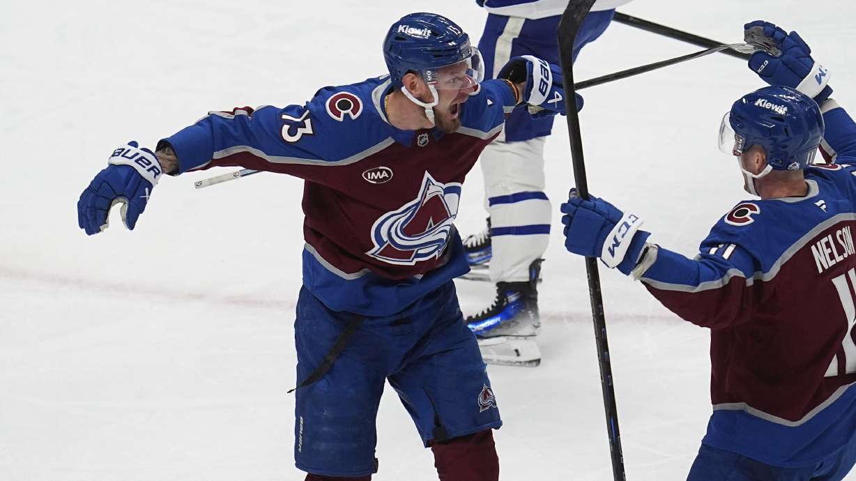 Colorado Avalanche right wing Valeri Nichushkin, left, celebrates after scoring his second goal with center Brock Nelson in the first period of an NHL hockey game against the Toronto Maple Leafs Saturday, March 8, 2025, in Denver.