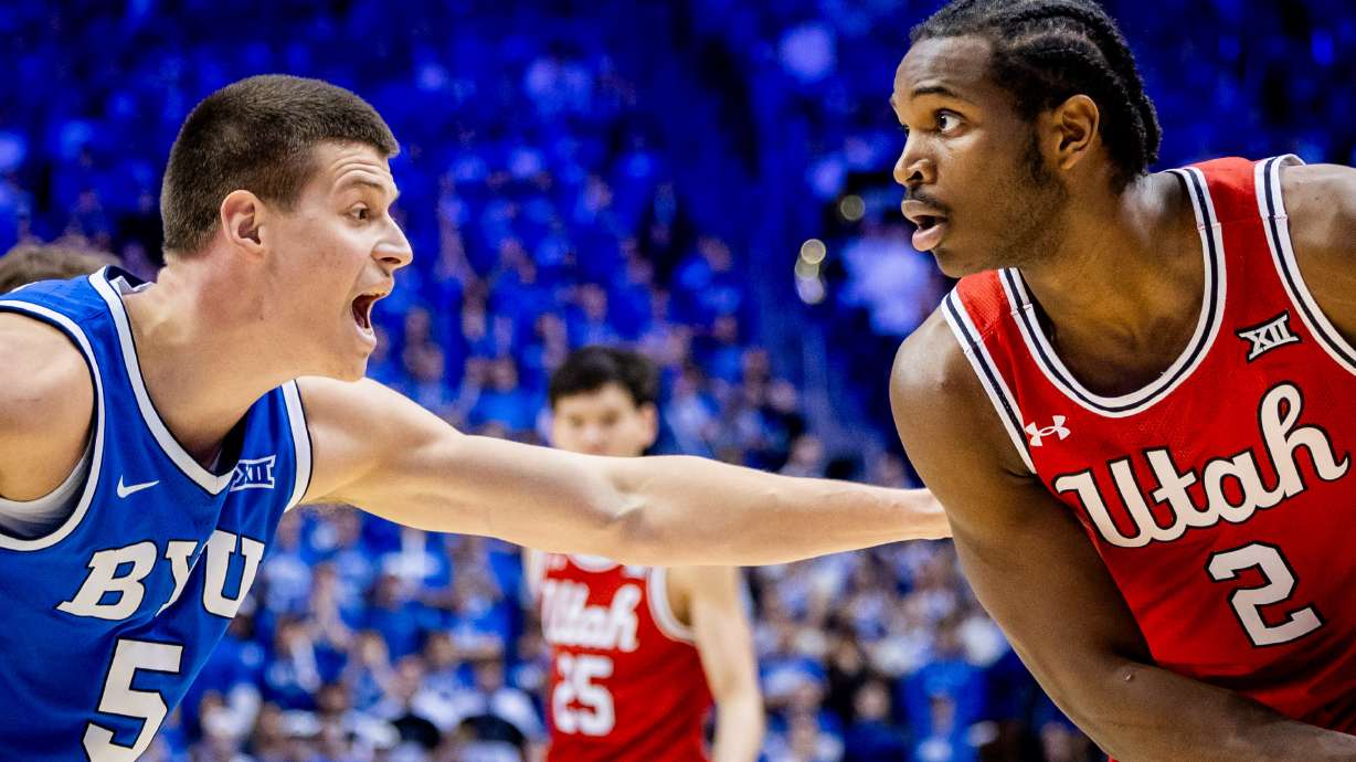 Utah Utes forward Ezra Ausar (2) is guarded by Brigham Young Cougars forward Mihailo Boskovic (5) during a basketball game at the Marriott Center at Brigham Young University in Provo on Saturday, March 8, 2025.